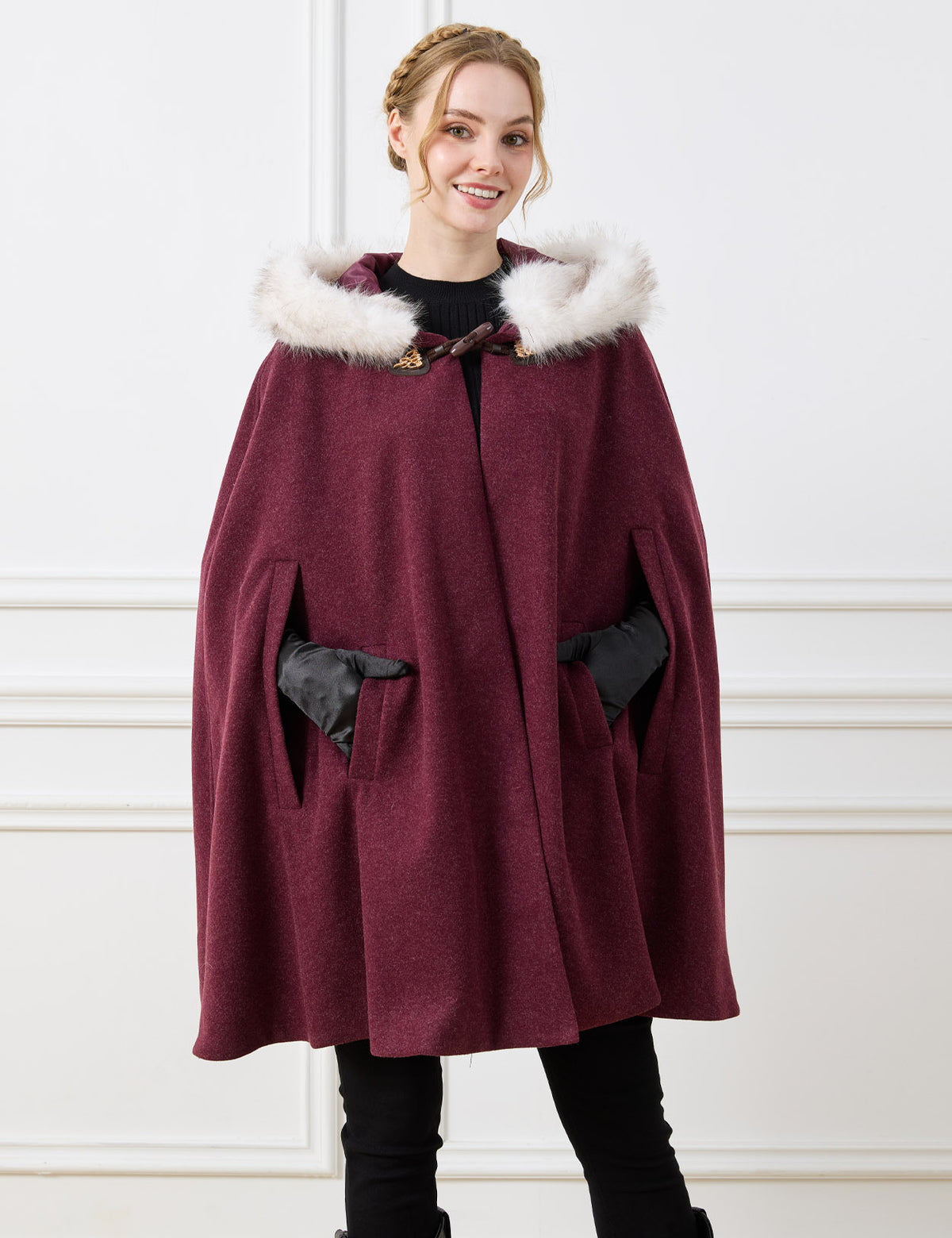 Beautelicate burgundy vintage inspired cloak, showcasing a smooth interior lining and a classic horn toggle, immersing you in a comfortable and fairytale-like aesthetic.
