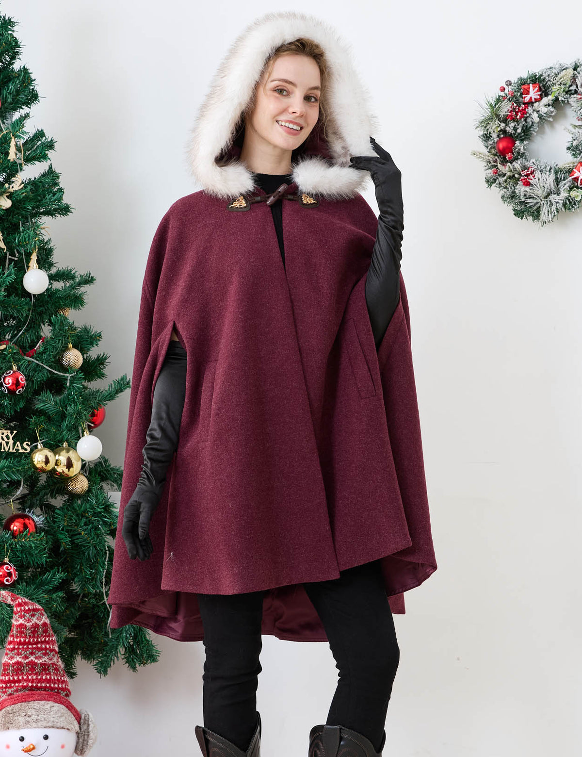 Beautelicate burgundy winter cloak, featuring a deep front drape and an oversized faux fur hood, perfect for effortless and comfortable layering during your romantic festive celebrations.