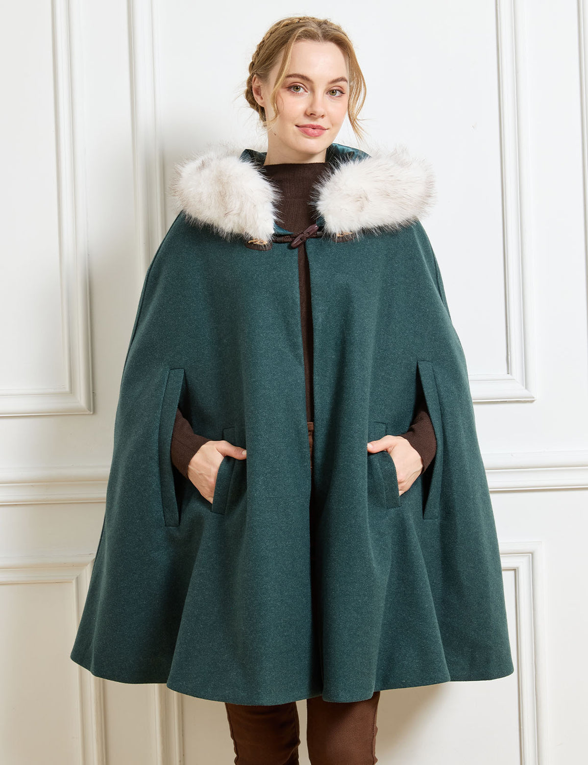 Beautelicate forest green winter cloak, highlighting ergonomic front arm slits and a cozy faux fur trim, designed for elegant and comfortable movement in your daily vintage look.