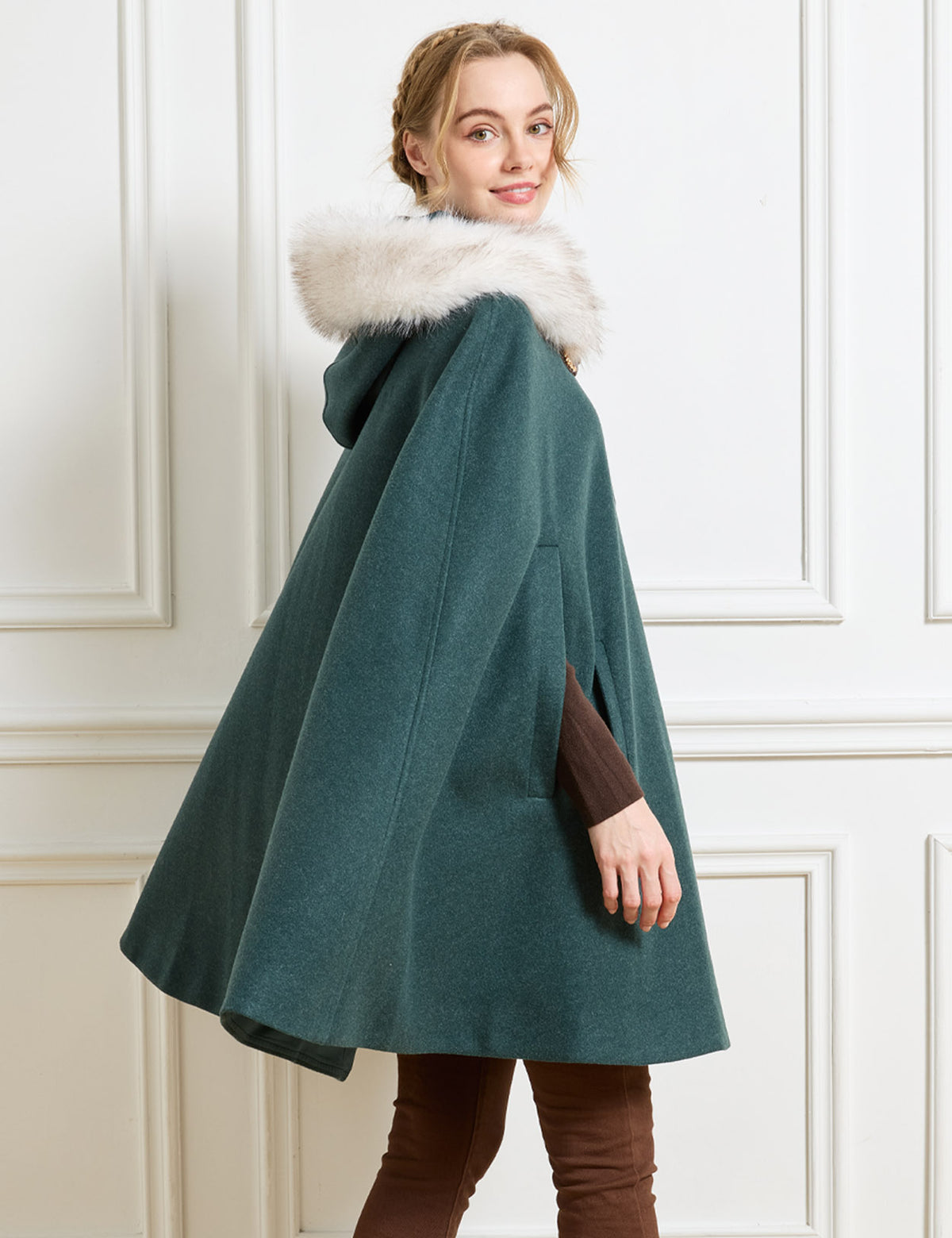 Beautelicate forest green wool cloak, showcasing a seamless shoulder design and fluid sweeping drape, offering an unrestrictive silhouette for your romantic old-world wardrobe.