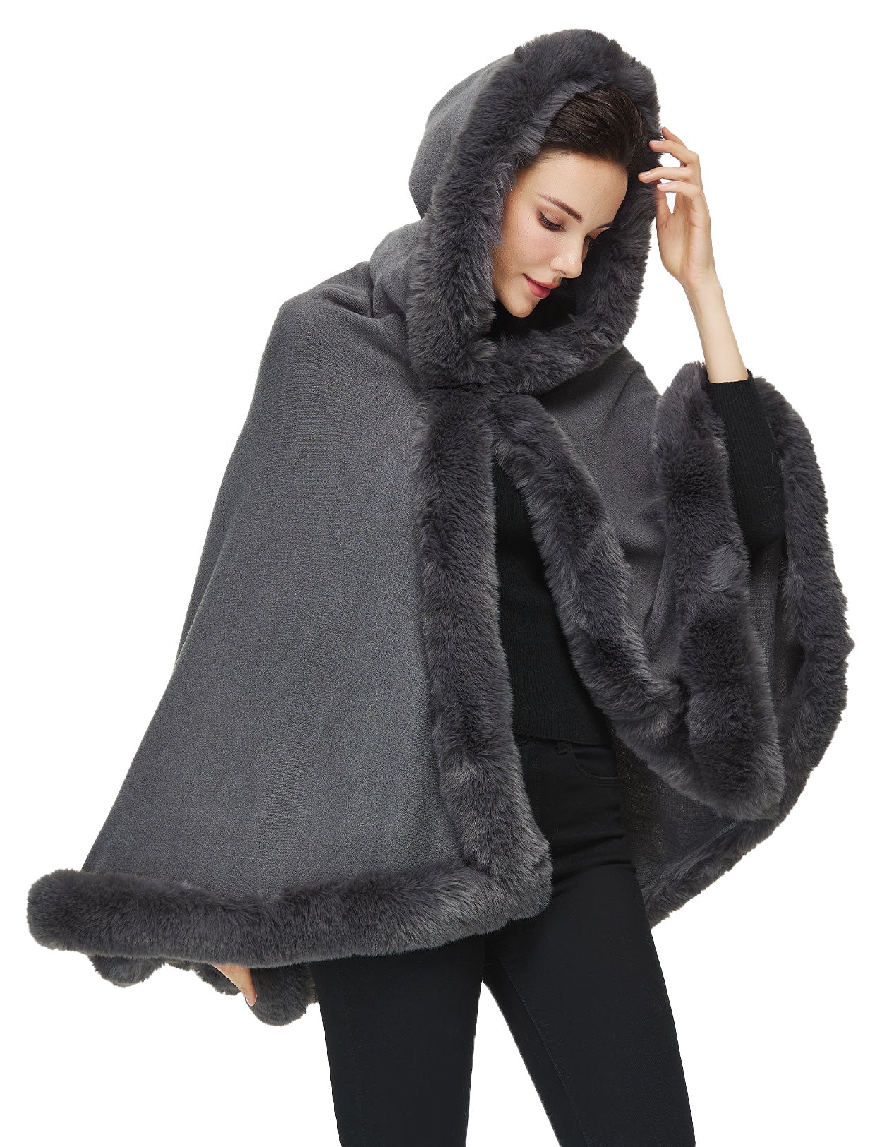 Women's faux fur poncho with hood showing elegant drape and texture