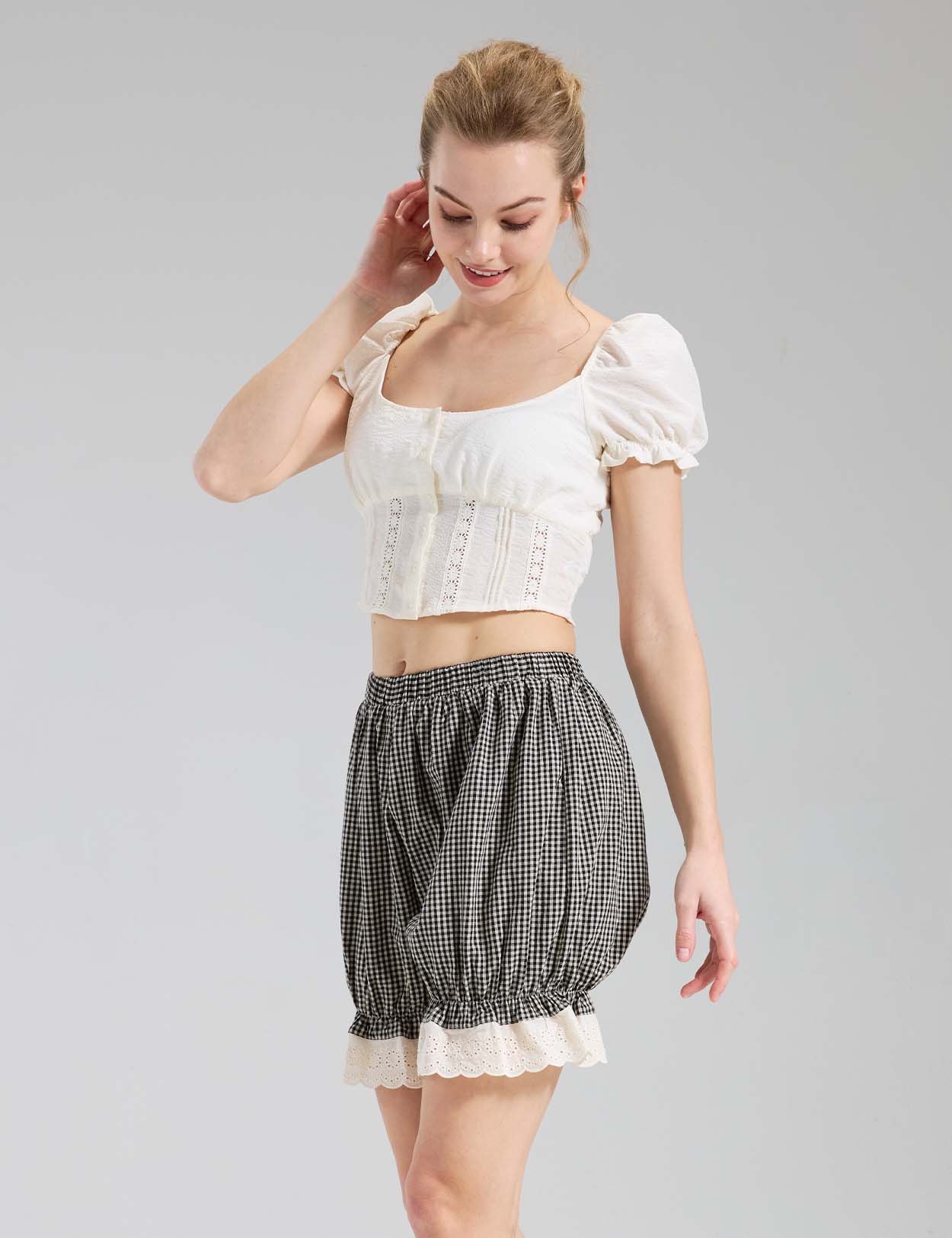 Beautelicate black and white gingham pumpkin bloomers with cream eyelet lace trim, side view, paired with cropped blouse