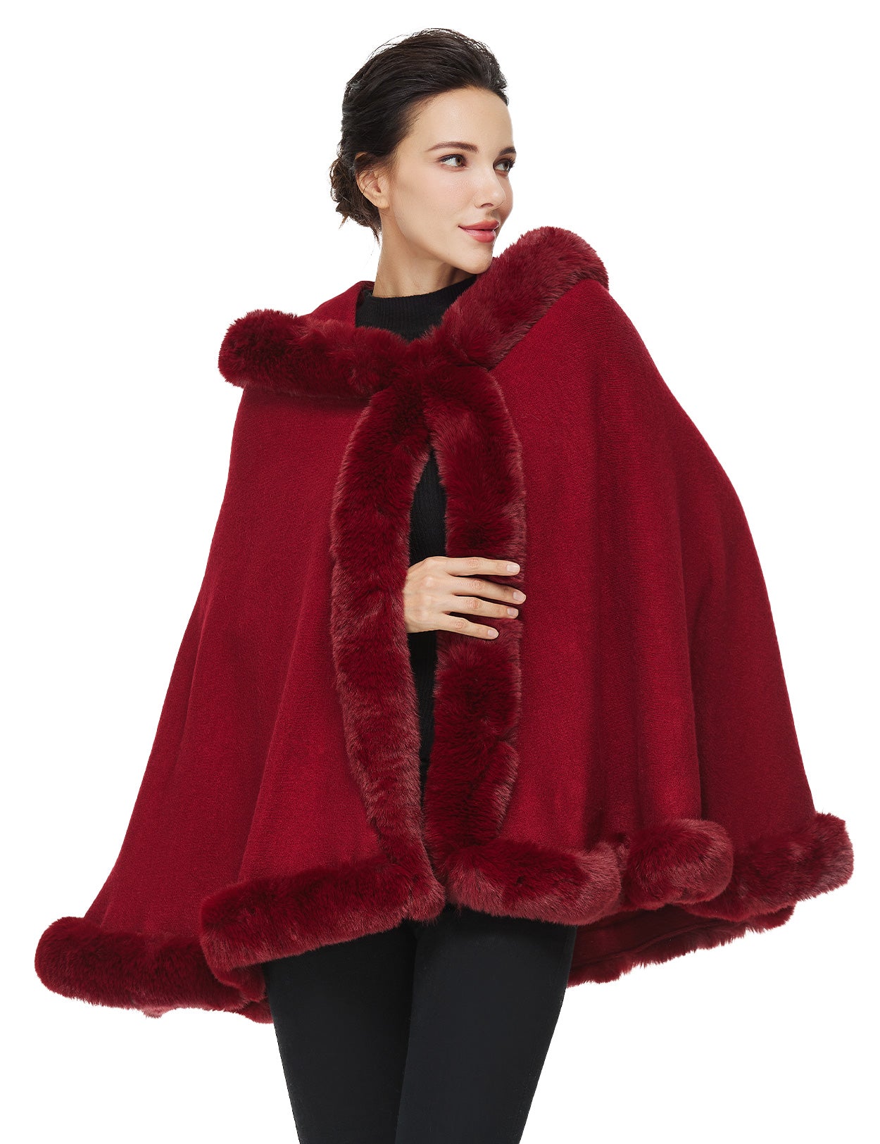 Women's faux fur poncho with hood showing elegant drape and texture