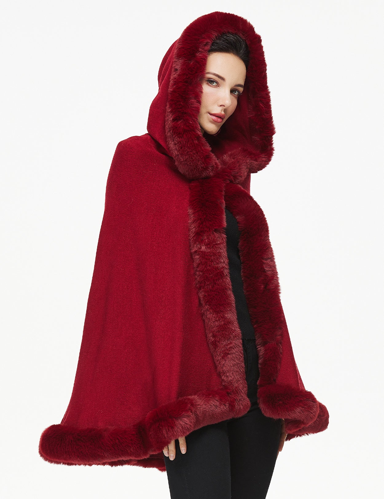 Women's faux fur poncho with hood showing elegant drape and texture