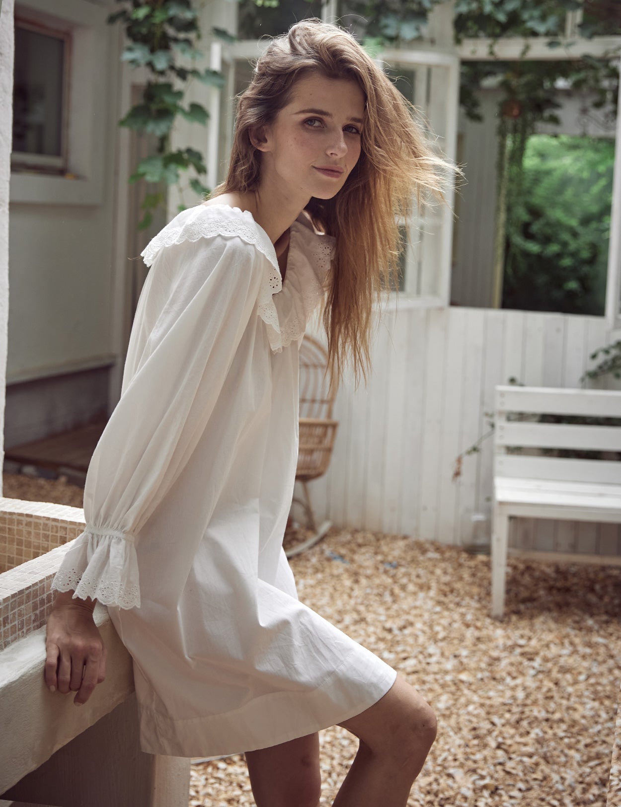 Side view of off-white cotton nightdress displaying loose A-line silhouette and elegant Victorian styling