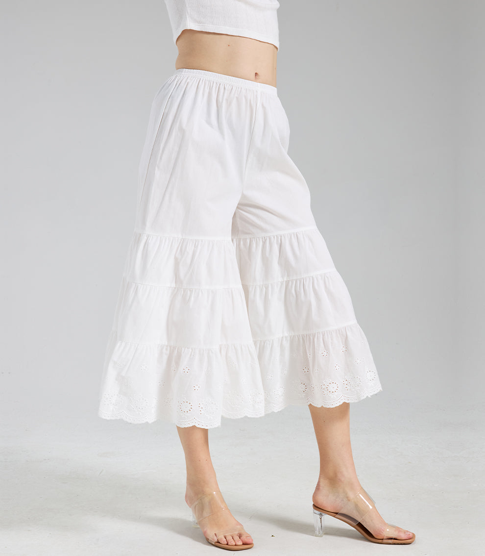 Side-front view of ivory ruffled bloomers showing the layered tiers and decorative eyelet lace trim.