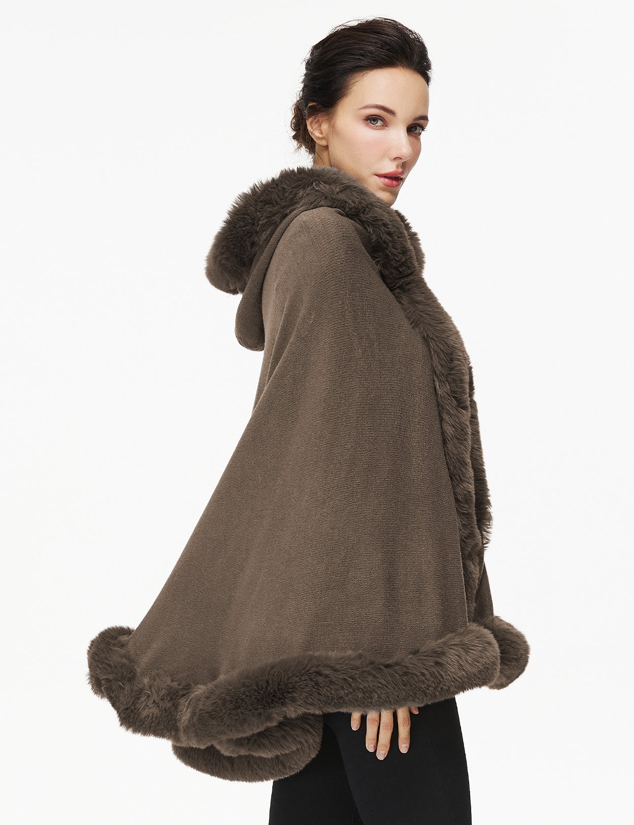 Women's faux fur poncho with hood showing elegant drape and texture