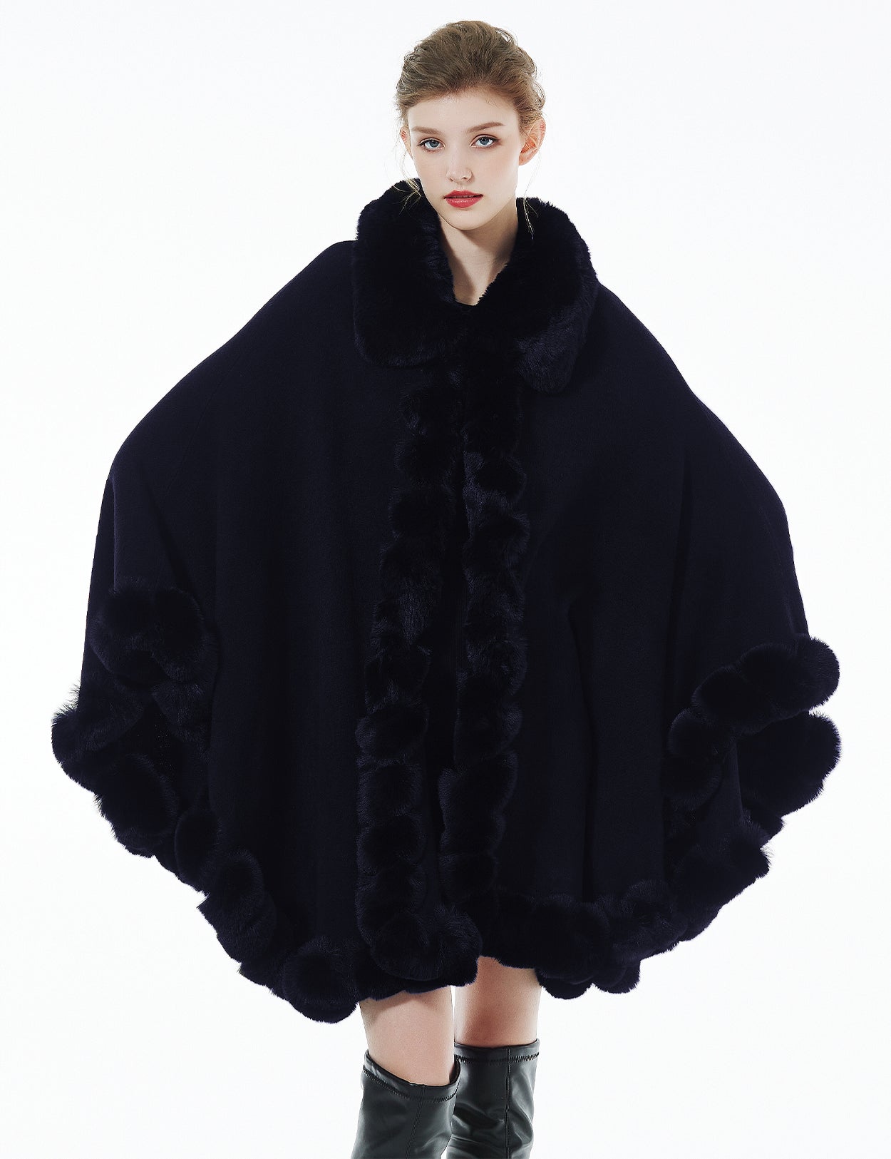 Trendy oversized knit cape coat with hood and faux fur trim