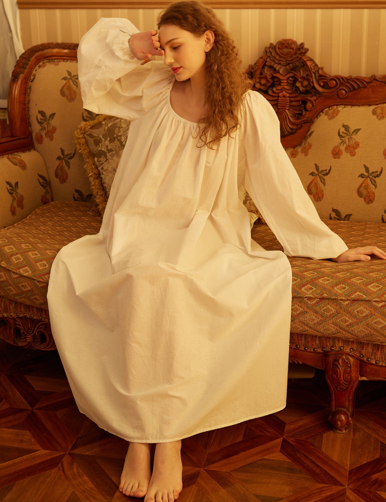 vintage Victorian cotton nightgown displaying the flowing design and comfortable long sleeve construction