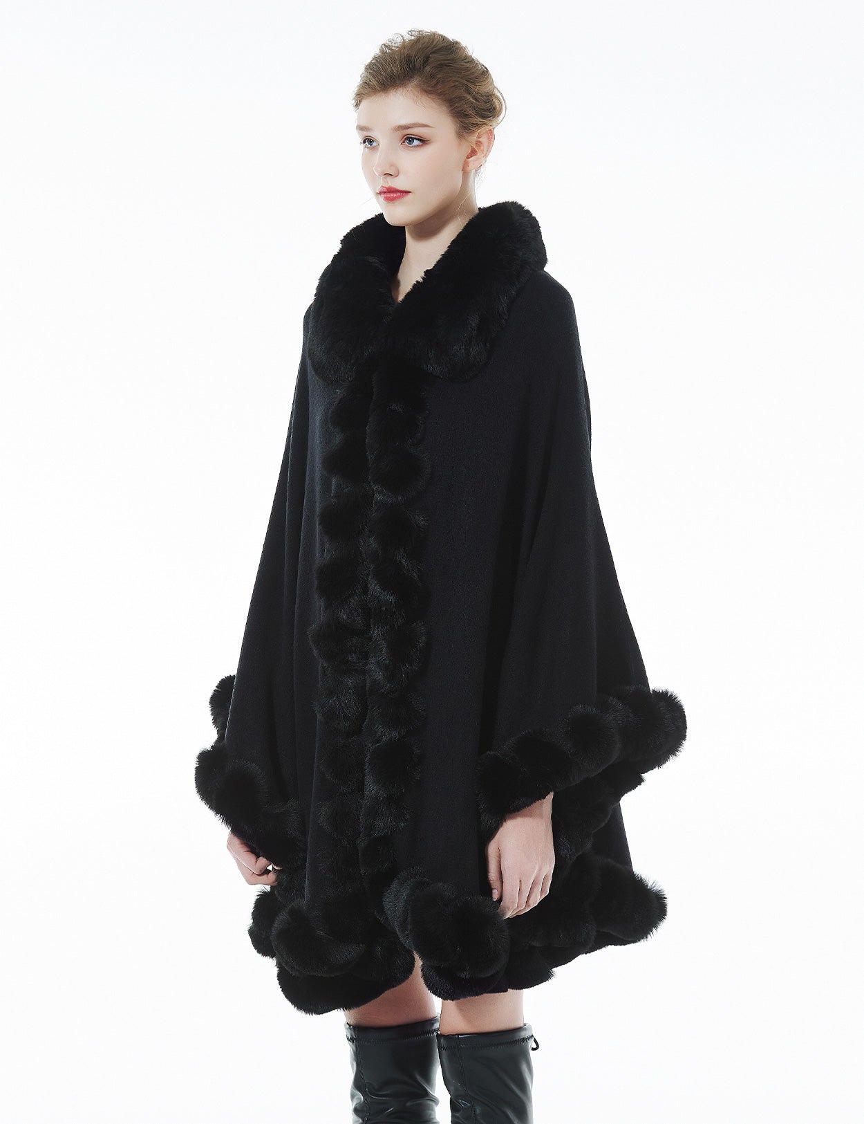 Trendy oversized knit cape coat with hood and faux fur trim