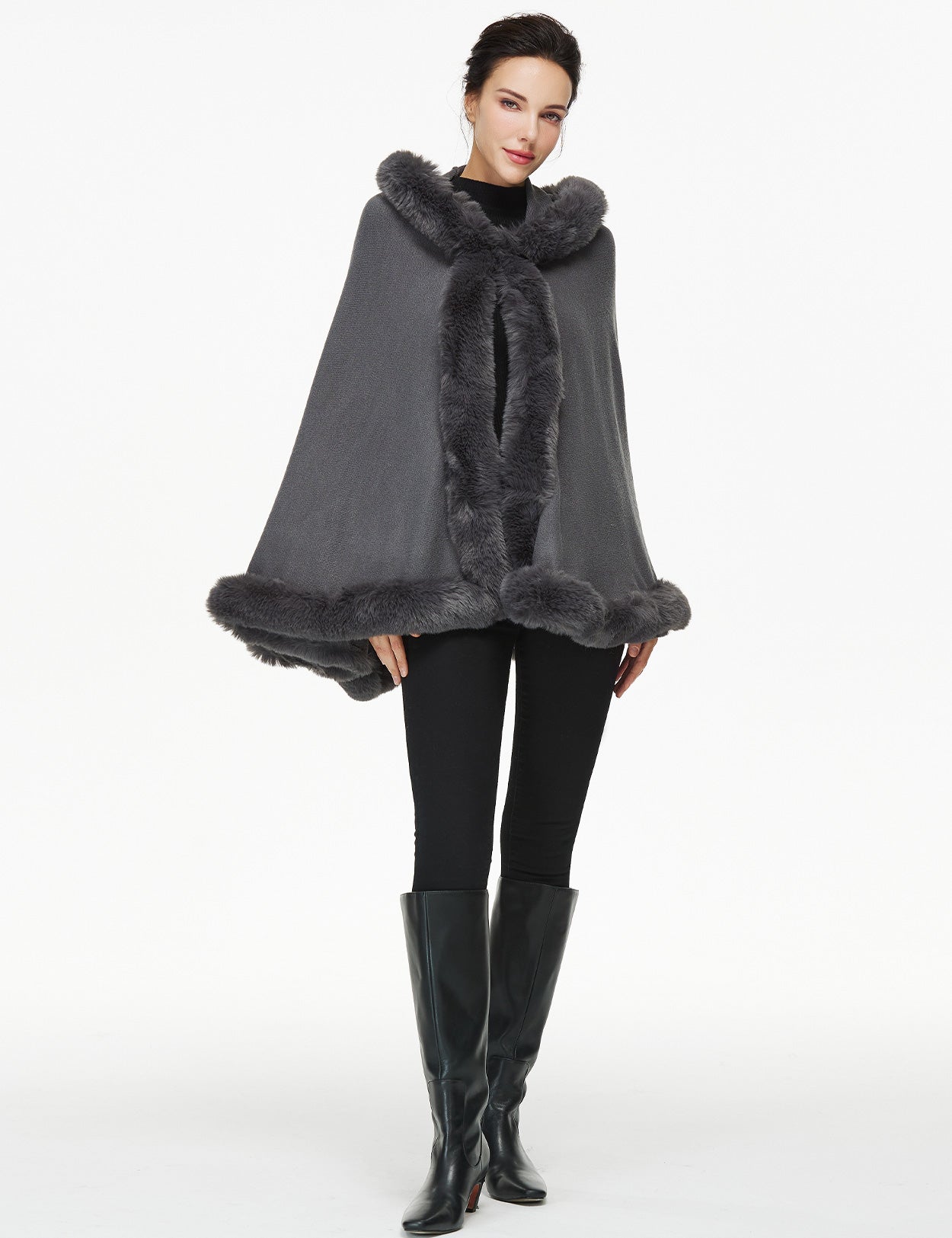 Women's faux fur poncho with hood showing elegant drape and texture
