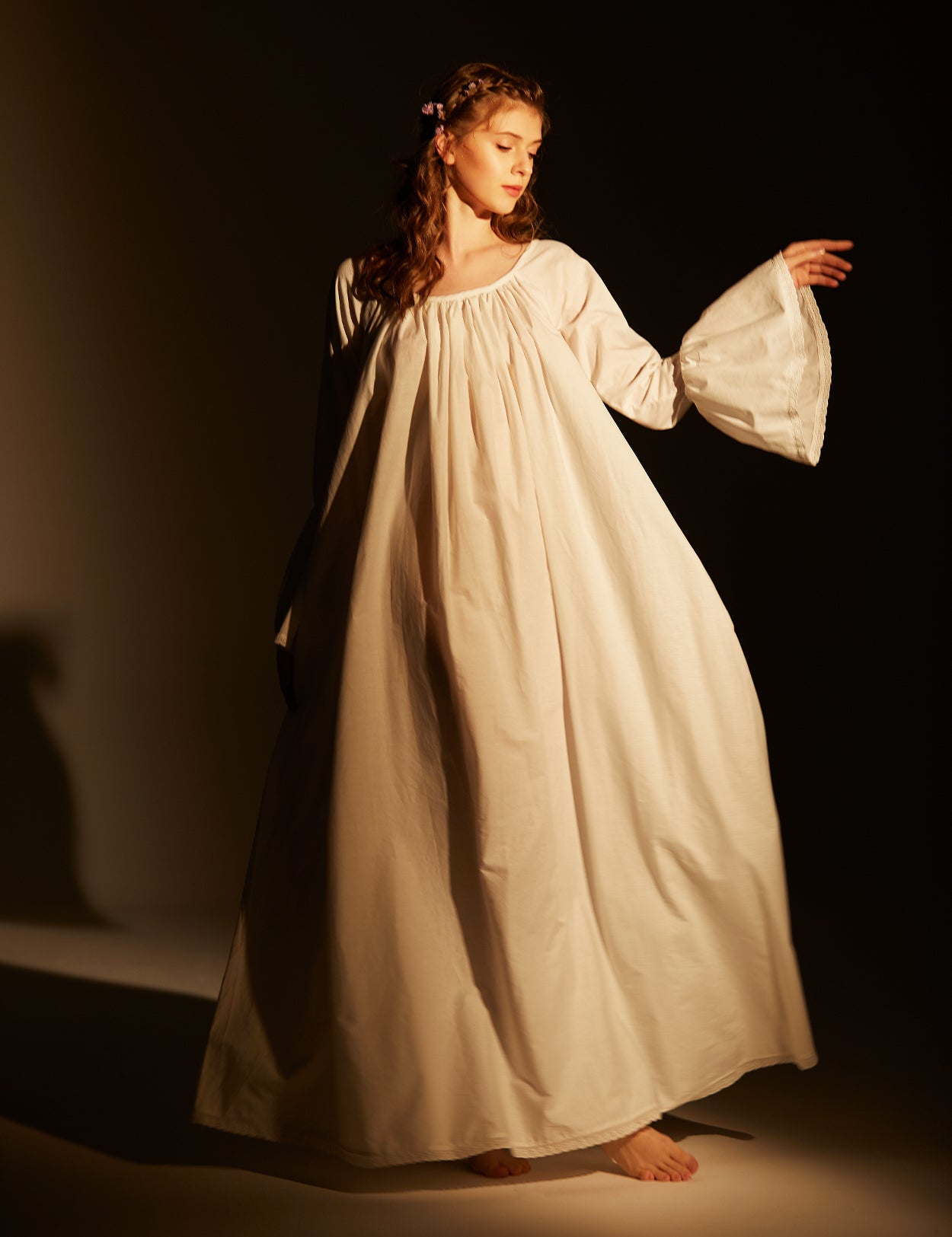 Front view of Victorian cotton nightgown showing full-length design and intricate lace trim details on bell sleeves