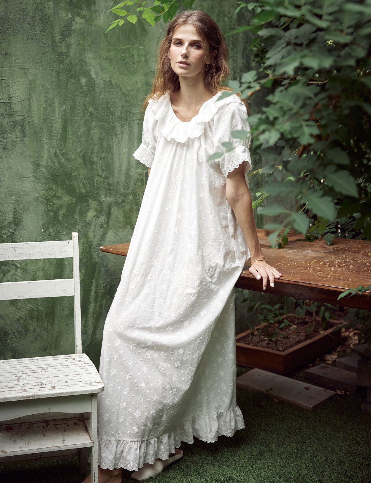 White Victorian cotton lace nightgown with ruffled sleeves and delicate embroidery