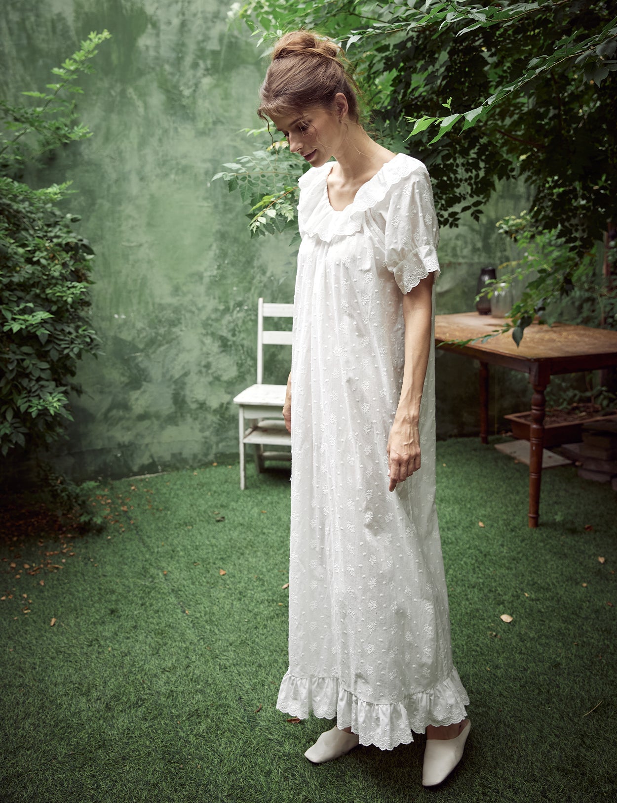 White Victorian cotton lace nightgown with ruffled sleeves and delicate embroidery