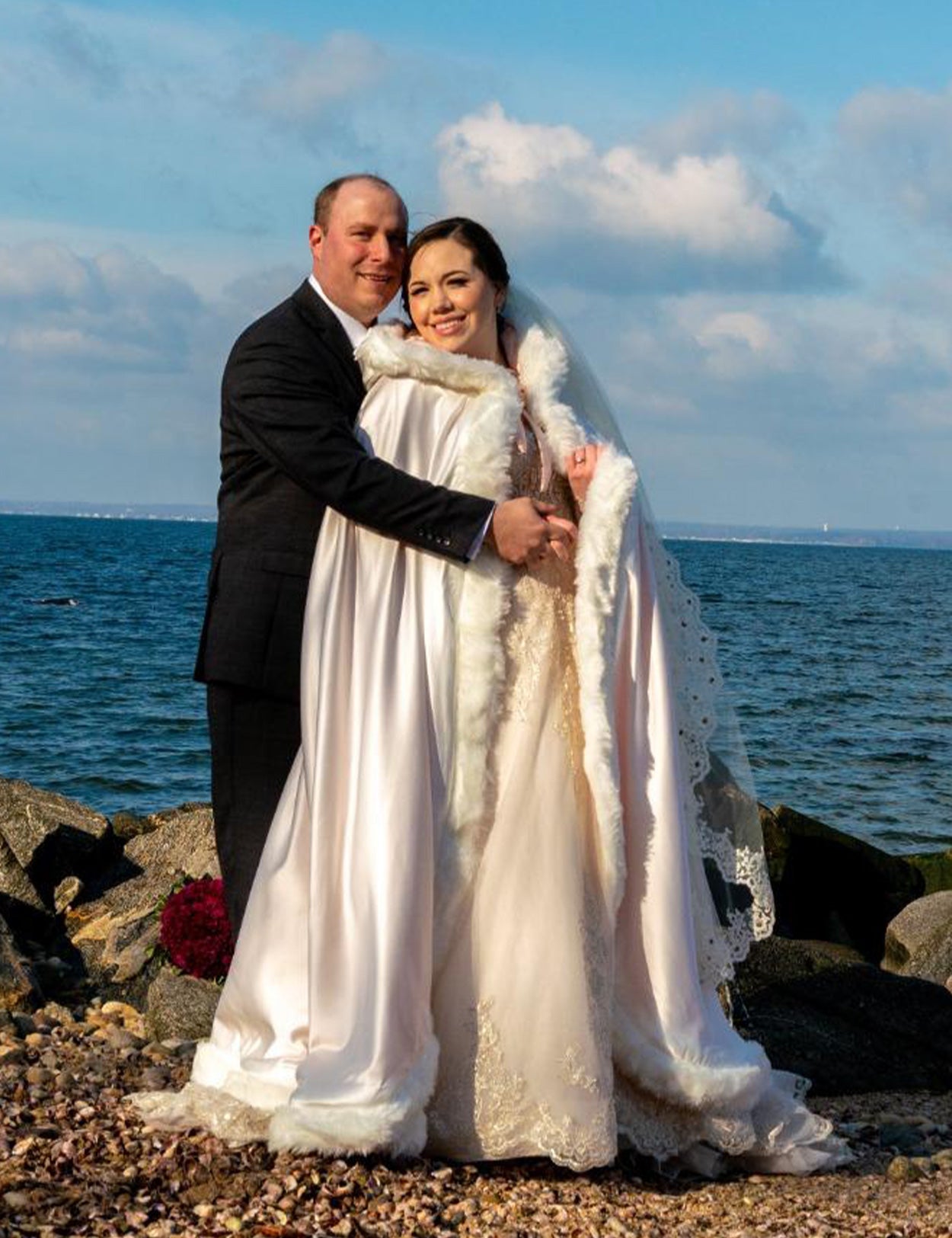 Reversible wedding cape with fur trim and hood customers wearing effect