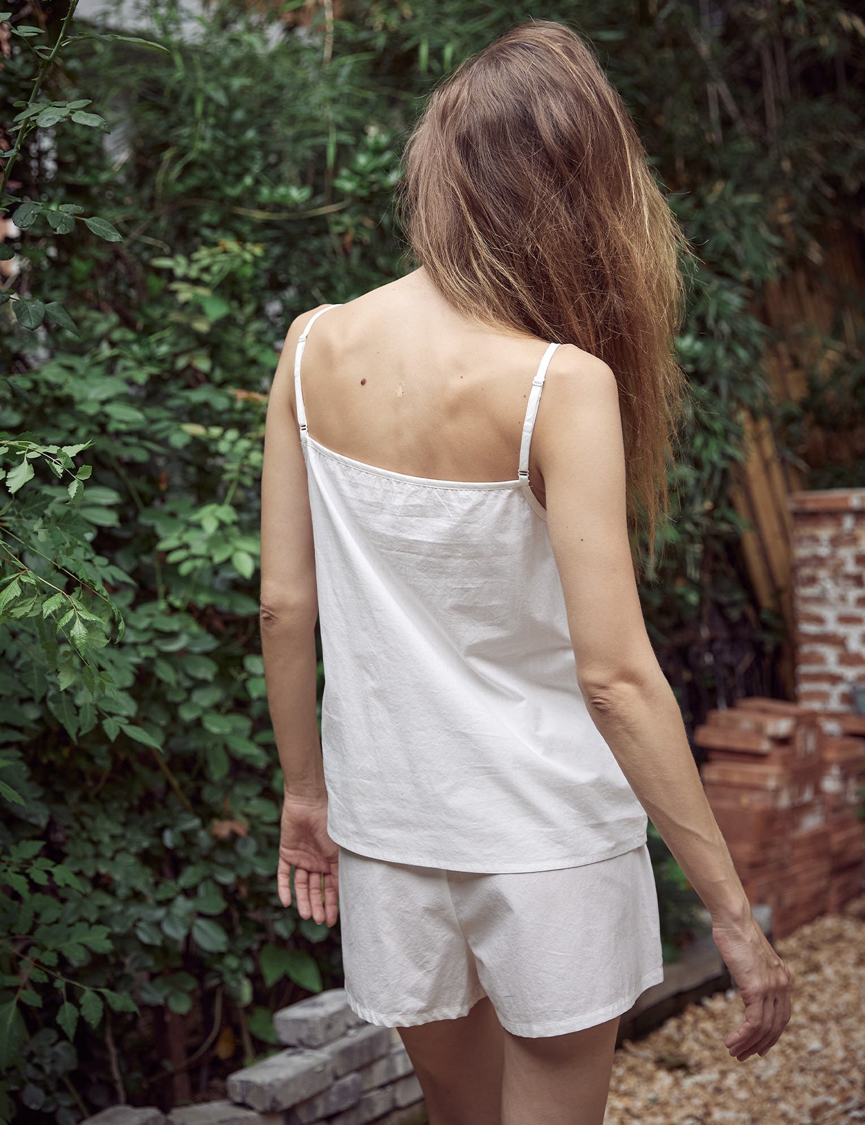 Adjustable strap 100% cotton camisole top in off white color - back view