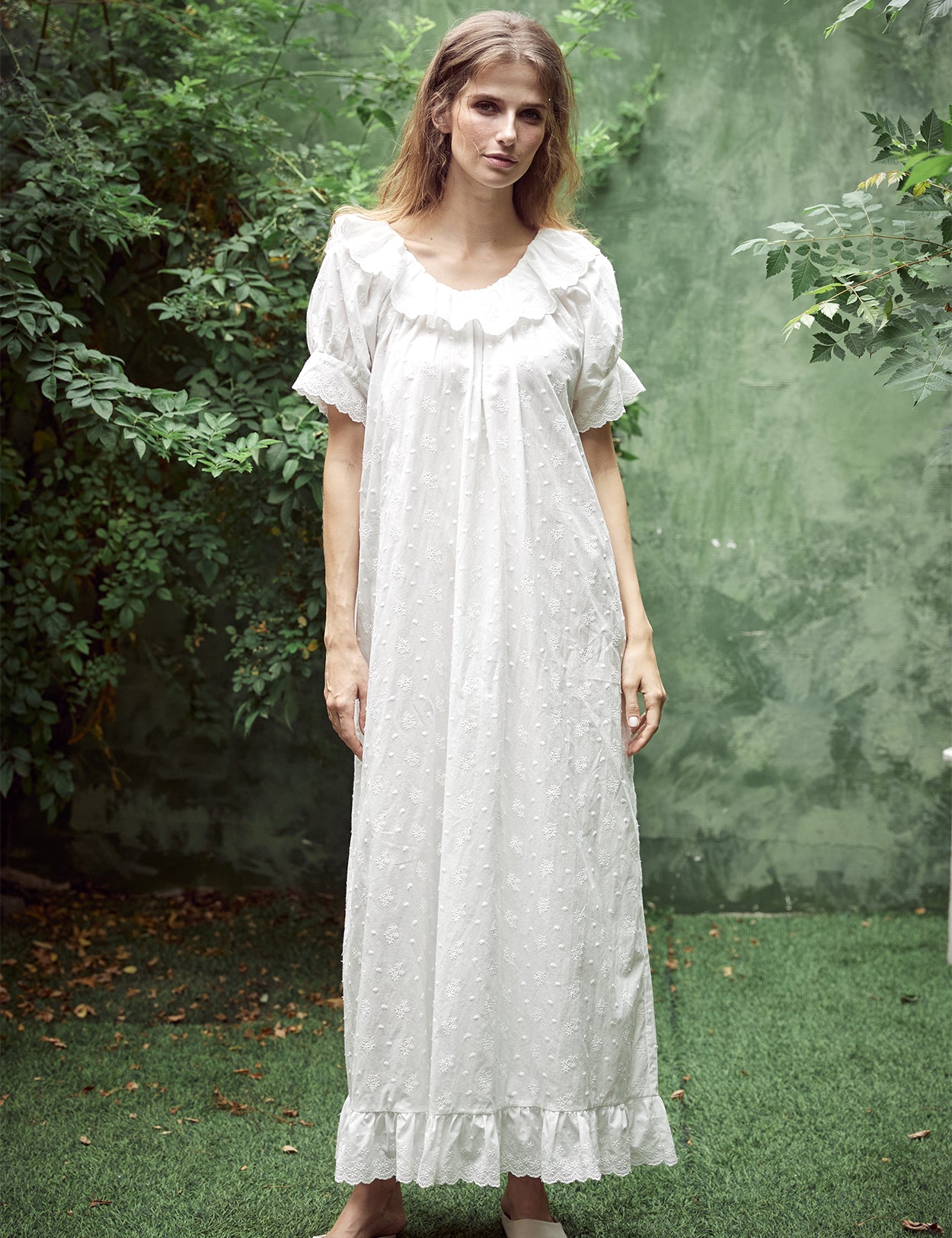 White Victorian cotton lace nightgown with ruffled sleeves and delicate embroidery