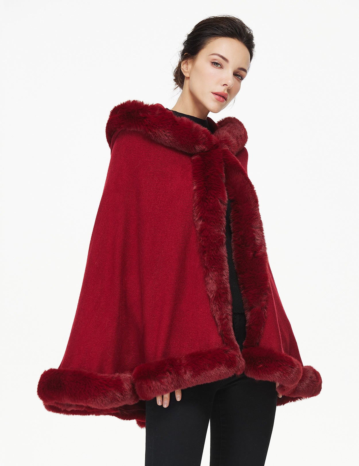 Women's faux fur poncho with hood showing elegant drape and texture