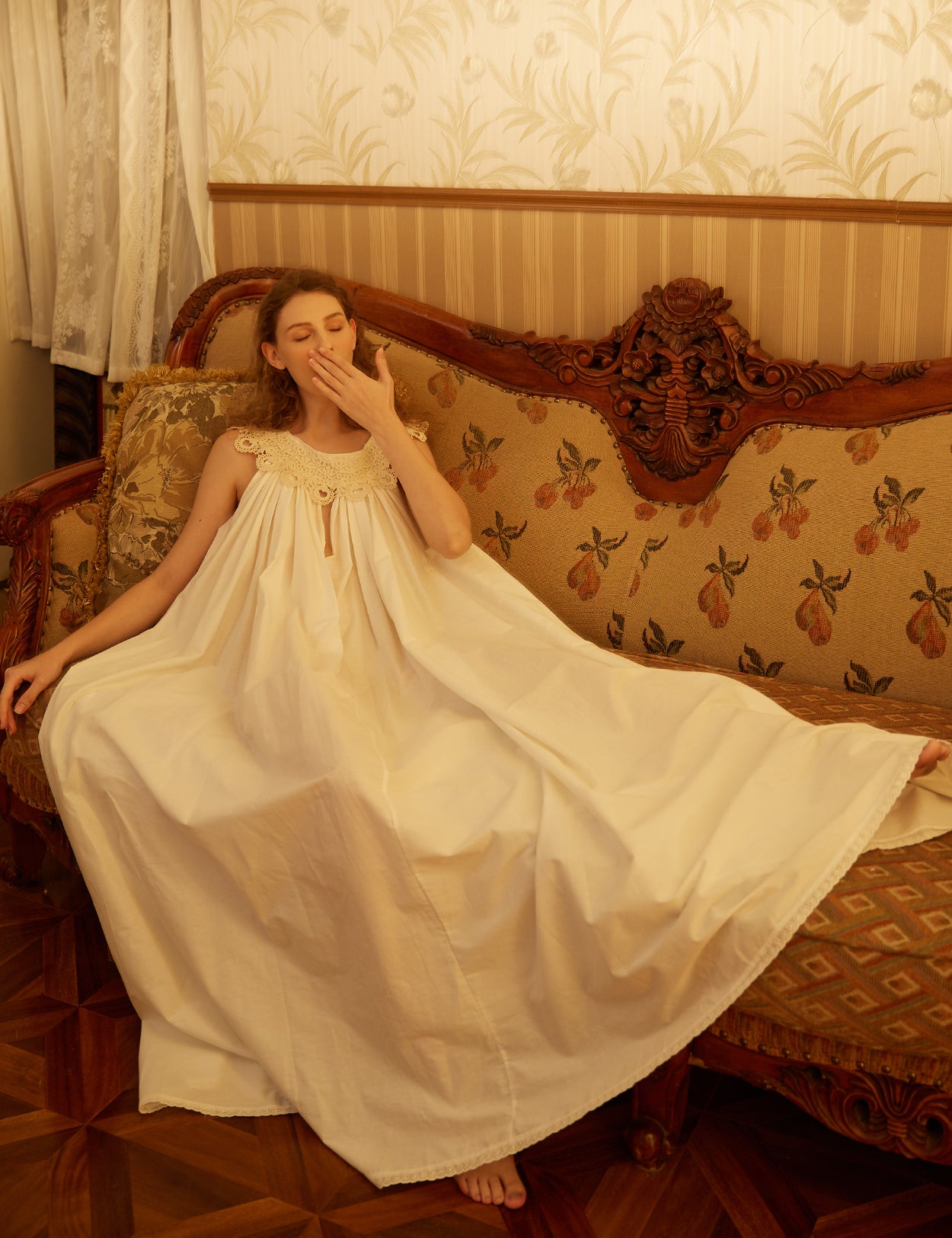 Victorian sleeveless cotton nightgown in white with elegant lace V-neck detail