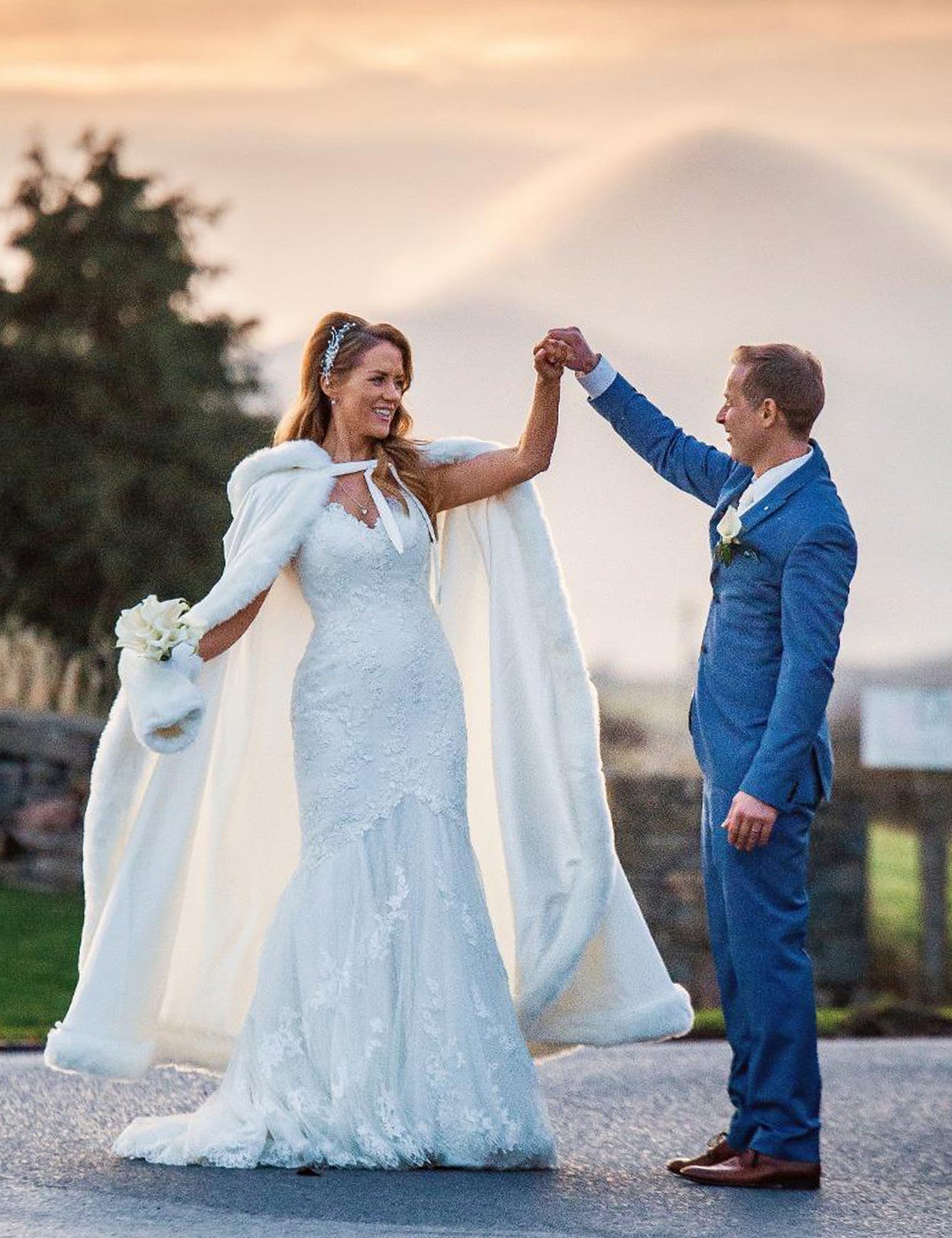 Reversible wedding cape with fur trim and hood customers wearing effect