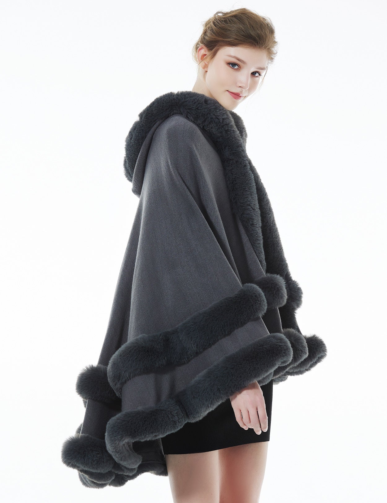 Model wearing stone grey hooded knit cape - front styling view showing elegant drape and fit