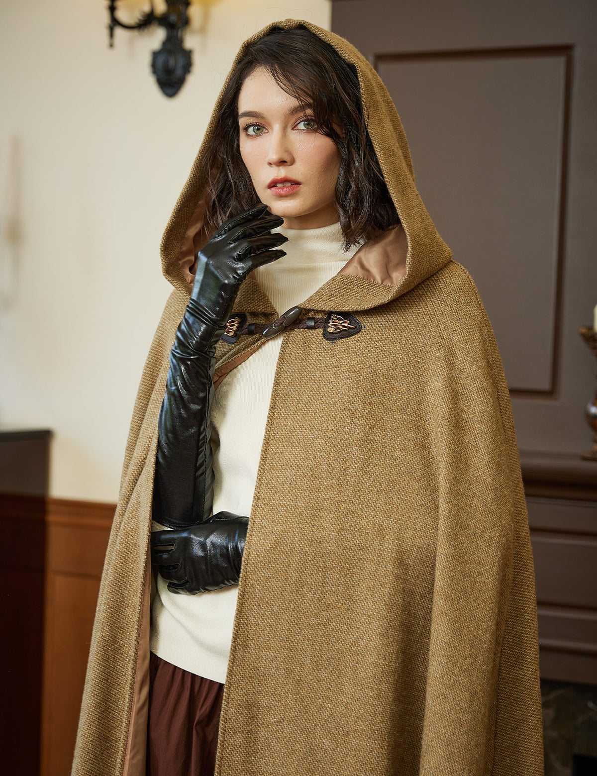 Women's medieval hooded cloak, showing vintage horn buckle closure