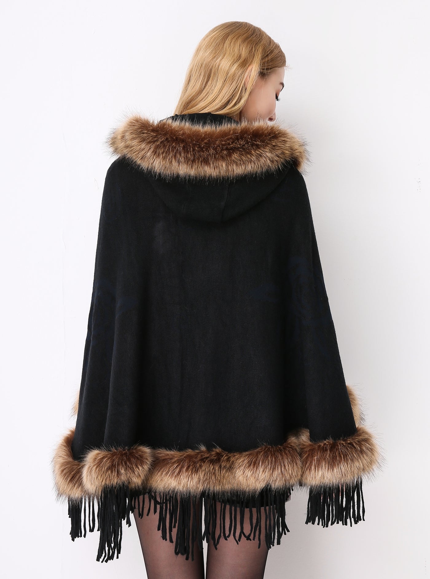Luxury faux fur hooded cape showing elegant draping and soft texture