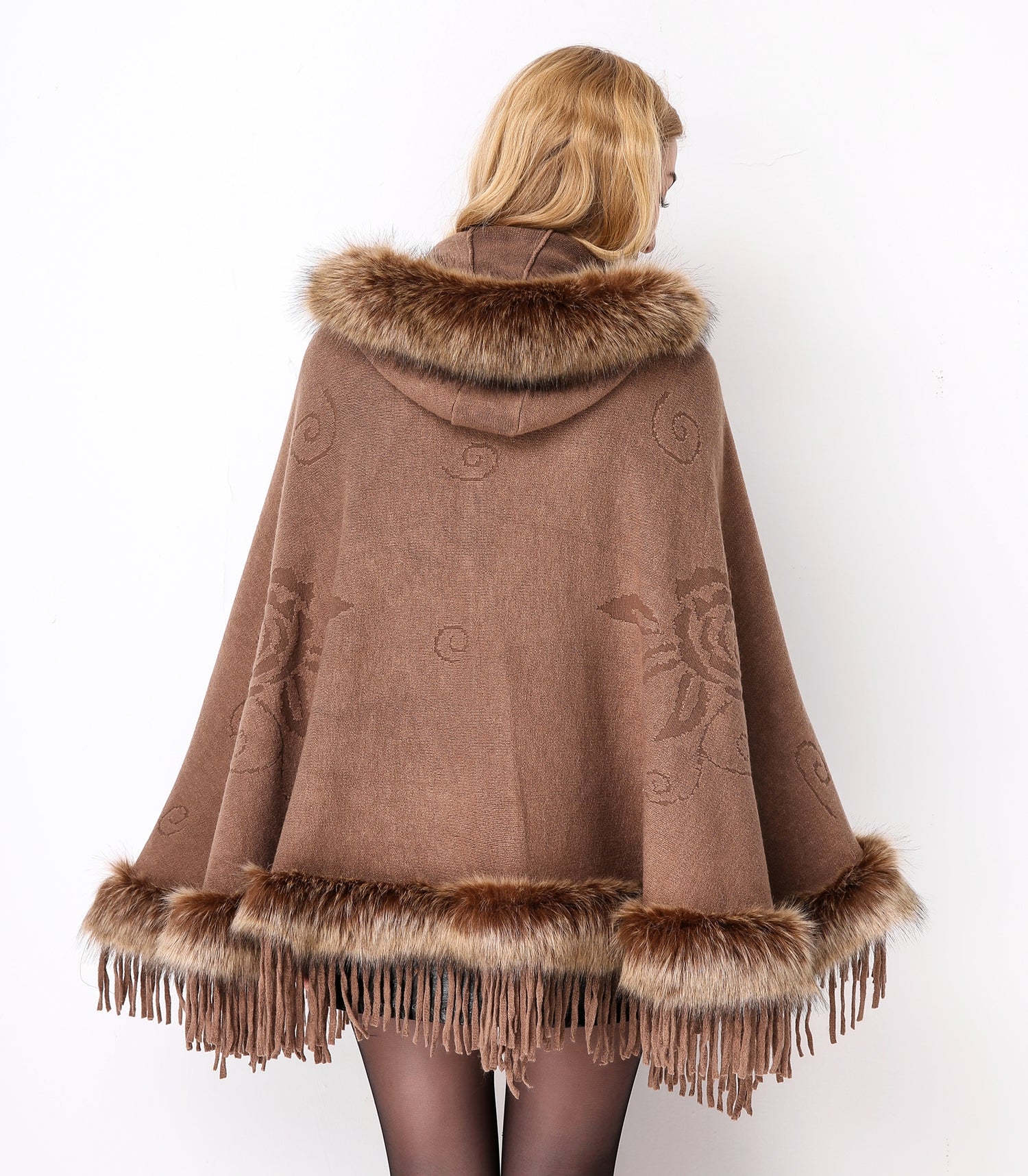 Luxury faux fur hooded cape showing elegant draping and soft texture