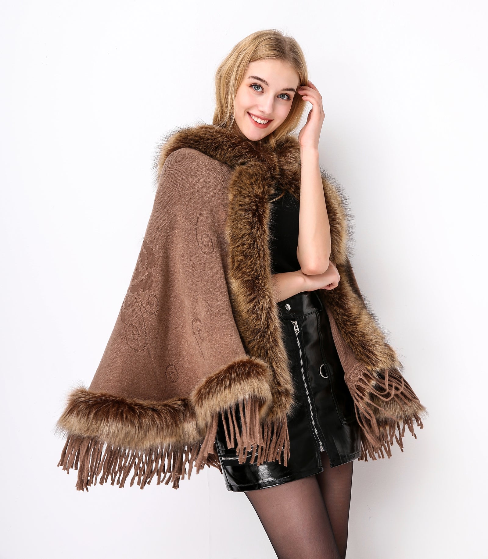 Luxury faux fur hooded cape showing elegant draping and soft texture