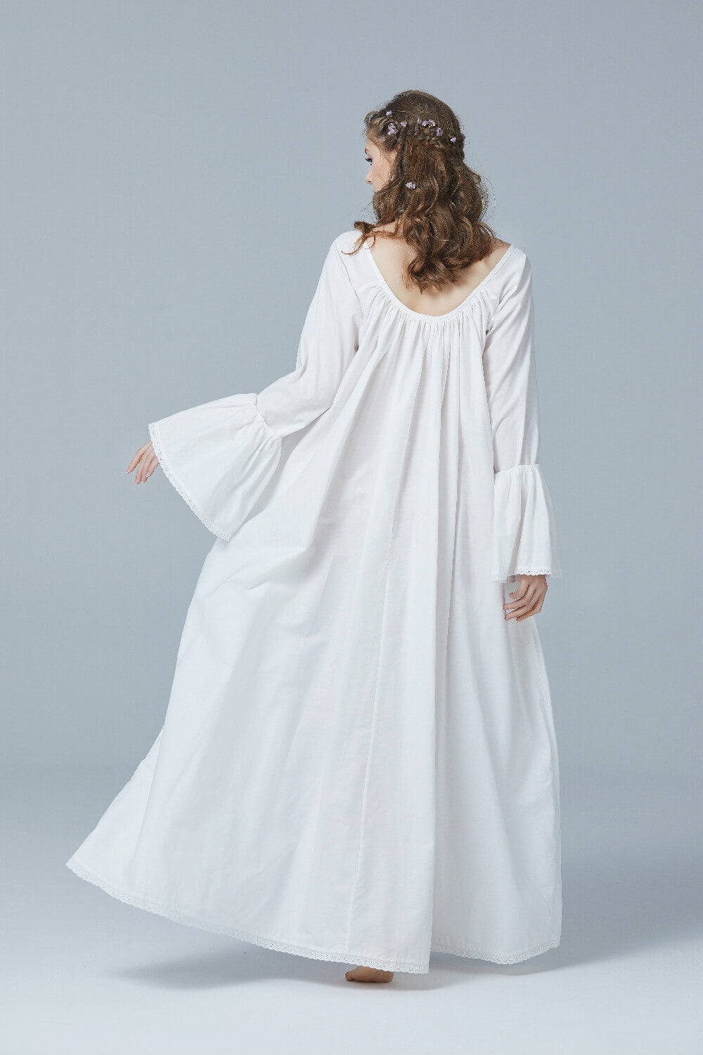 back view of Victorian nightgown highlighting the flowing bell sleeve silhouette and comfortable fit