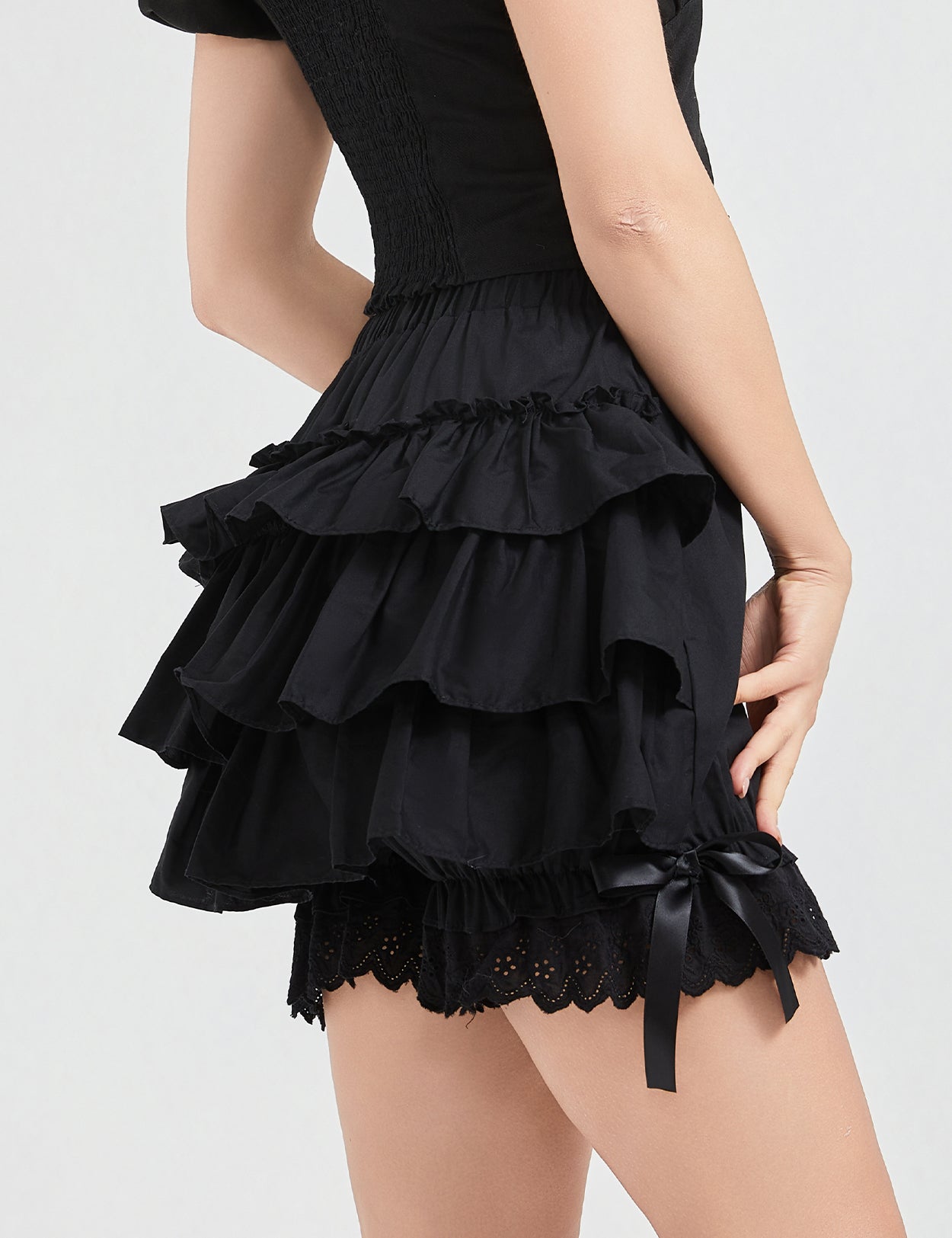 Side view of vintage cotton bloomers displaying tiered ruffle layers and comfortable fit