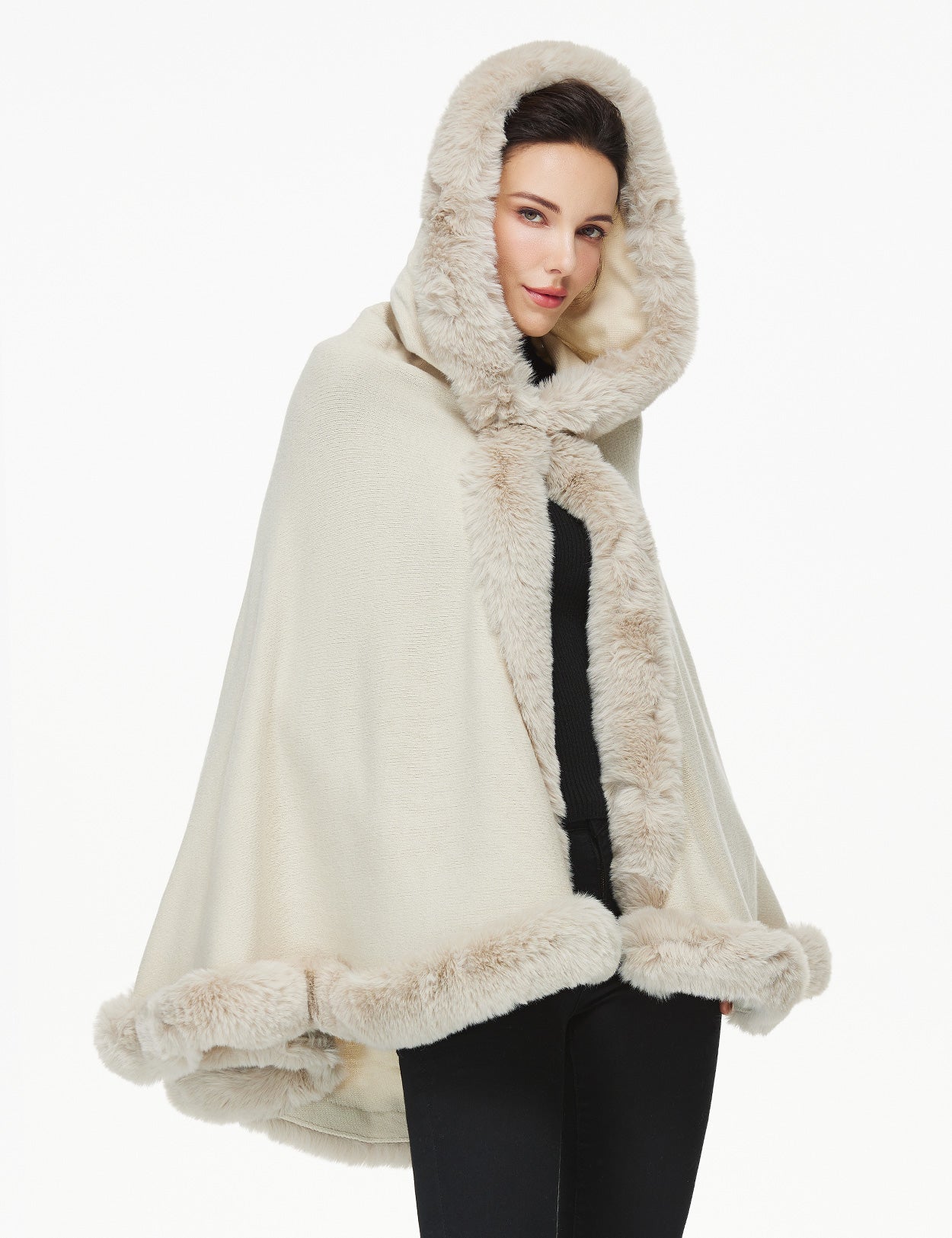 Women's faux fur poncho with hood showing elegant drape and texture