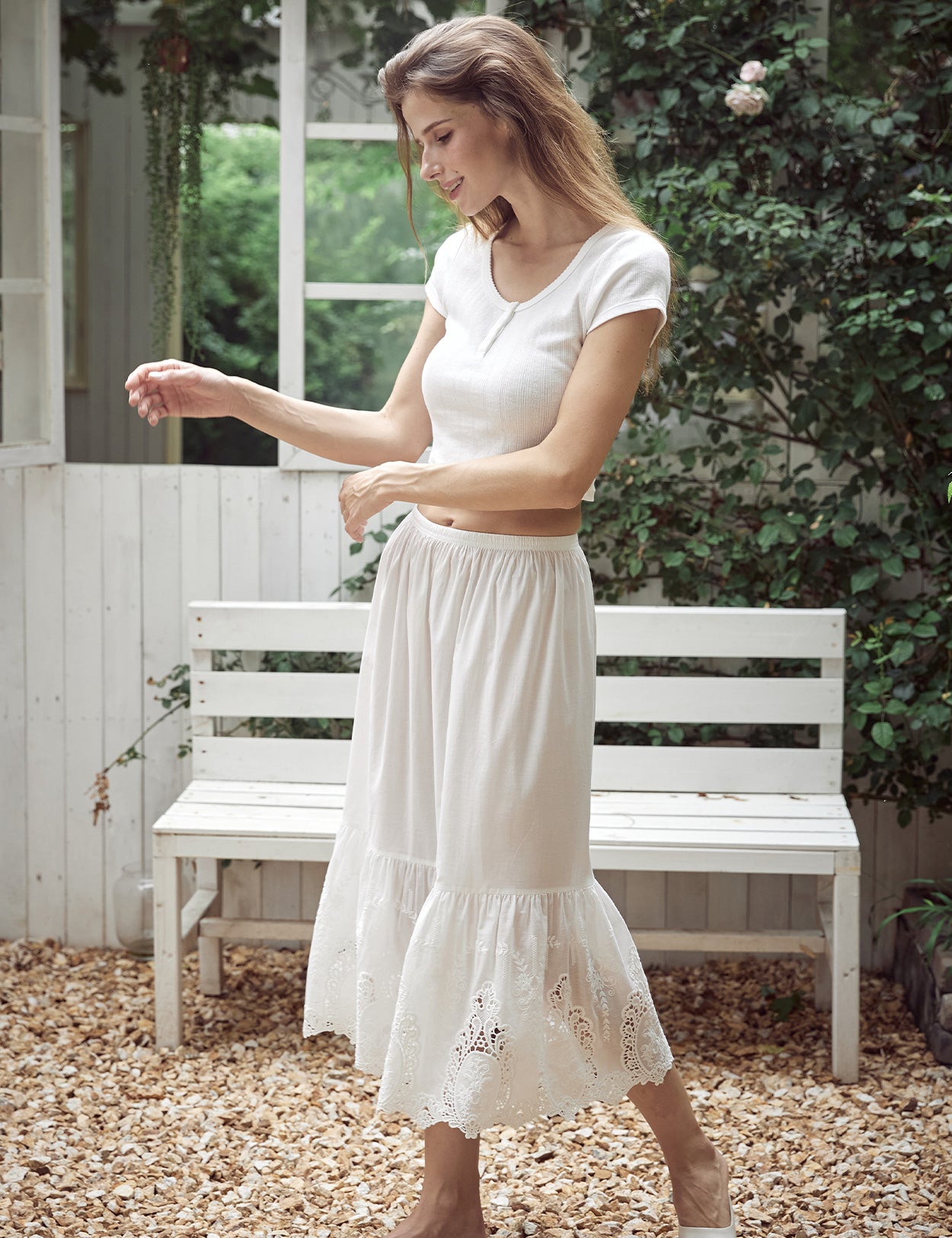 raised patterns and lace cutouts on ivory cotton slip