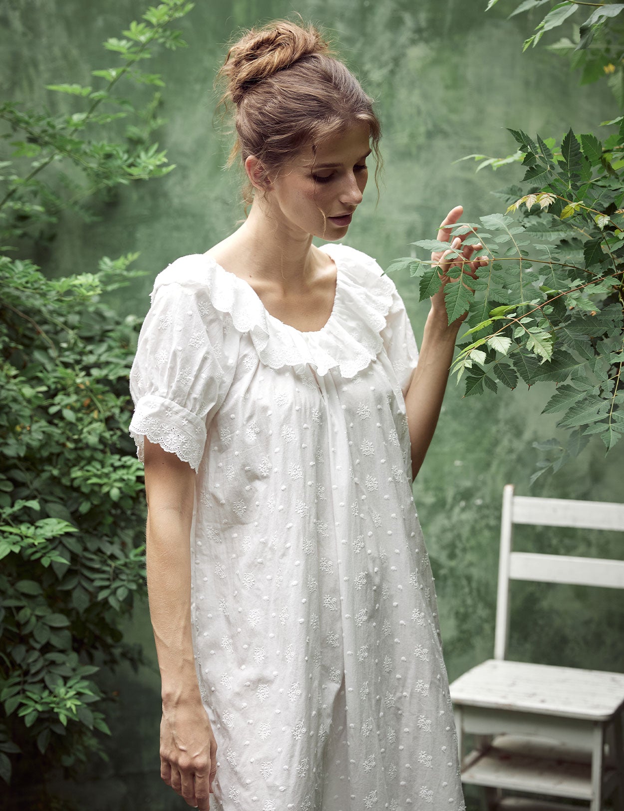 White Victorian cotton lace nightgown with ruffled sleeves and delicate embroidery