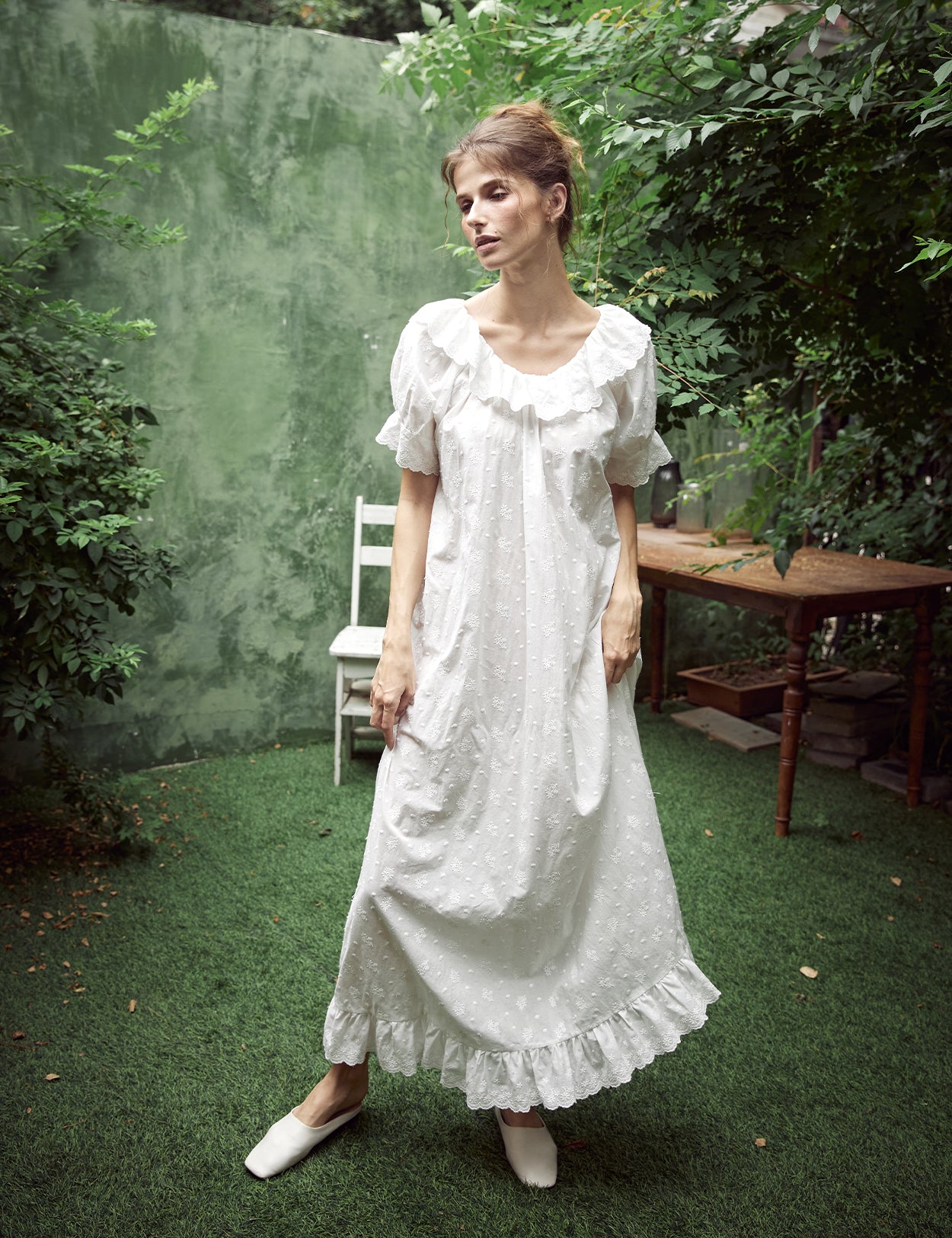 White Victorian cotton lace nightgown with ruffled sleeves and delicate embroidery
