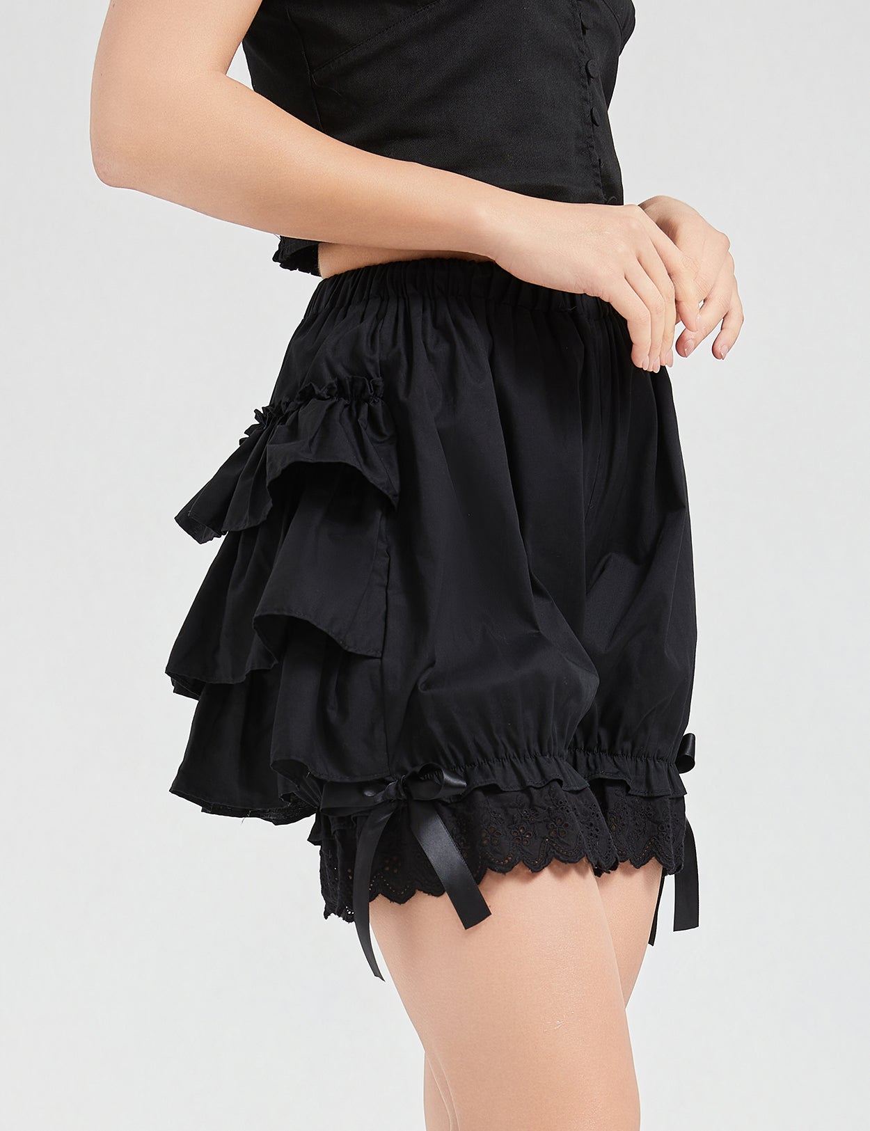 Side view of vintage cotton bloomers displaying tiered ruffle layers and comfortable fit