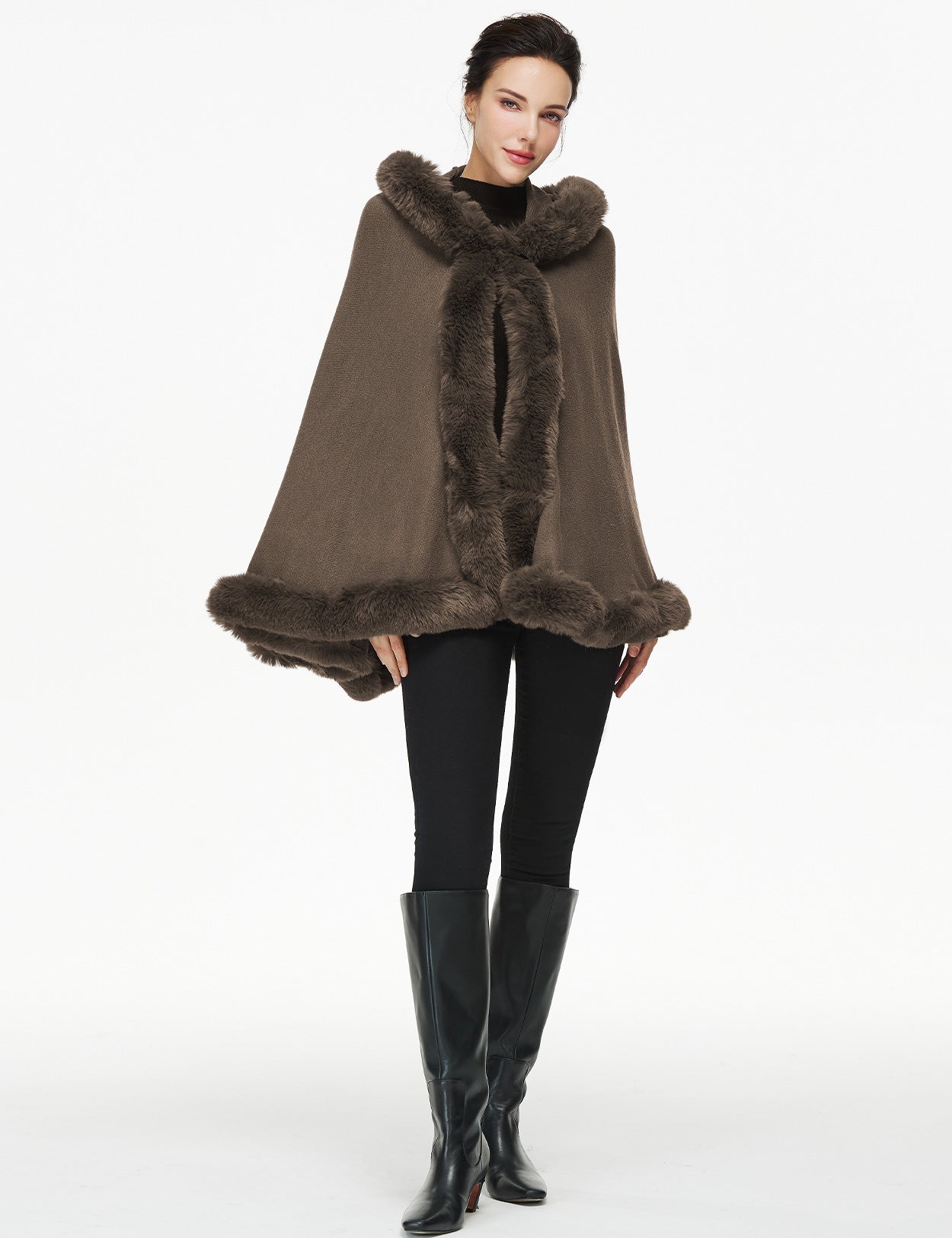 Women's faux fur poncho with hood showing elegant drape and texture