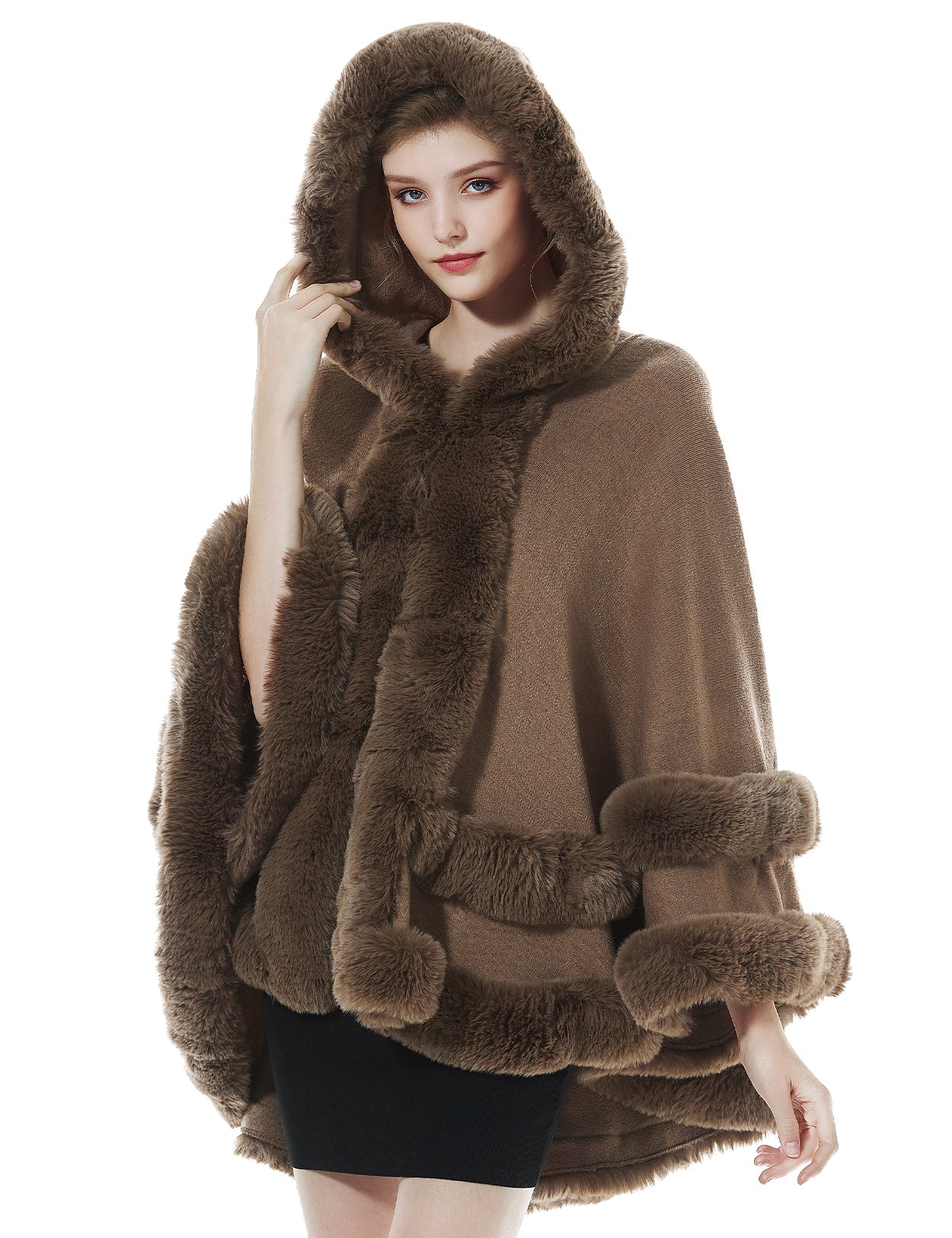 Detailed close-up of khaki knit cape's oversized hood with luxurious faux fur lining