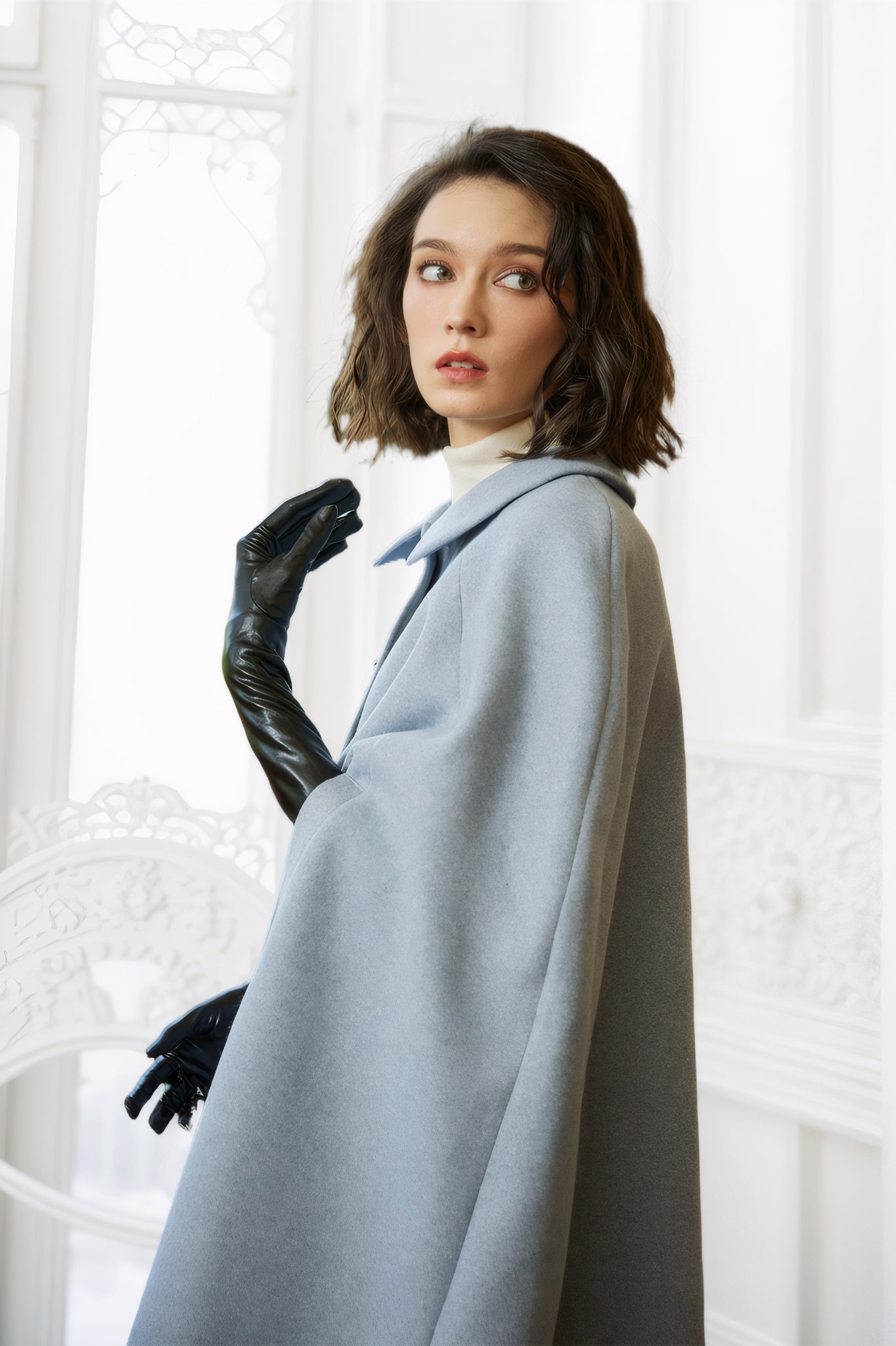 Wool blend cloak with slit sleeves and pockets - showing elegant winter cape design