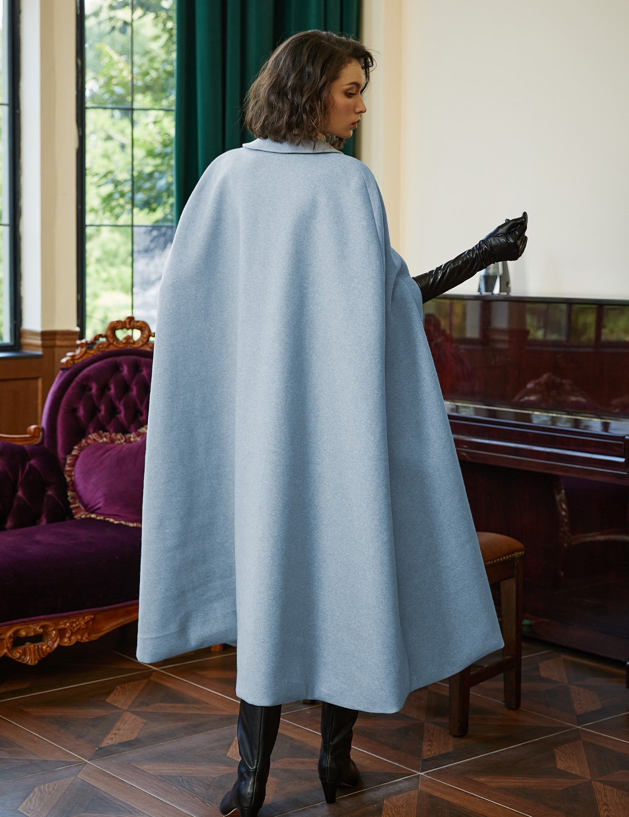 Wool blend cloak with slit sleeves and pockets - back view showing elegant winter cape design