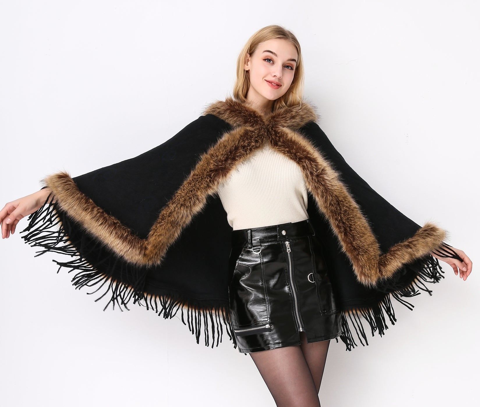 Luxury faux fur hooded cape showing elegant draping and soft texture