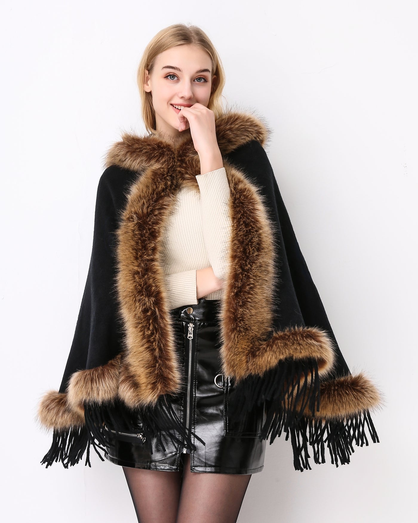 Luxury faux fur hooded cape showing elegant draping and soft texture