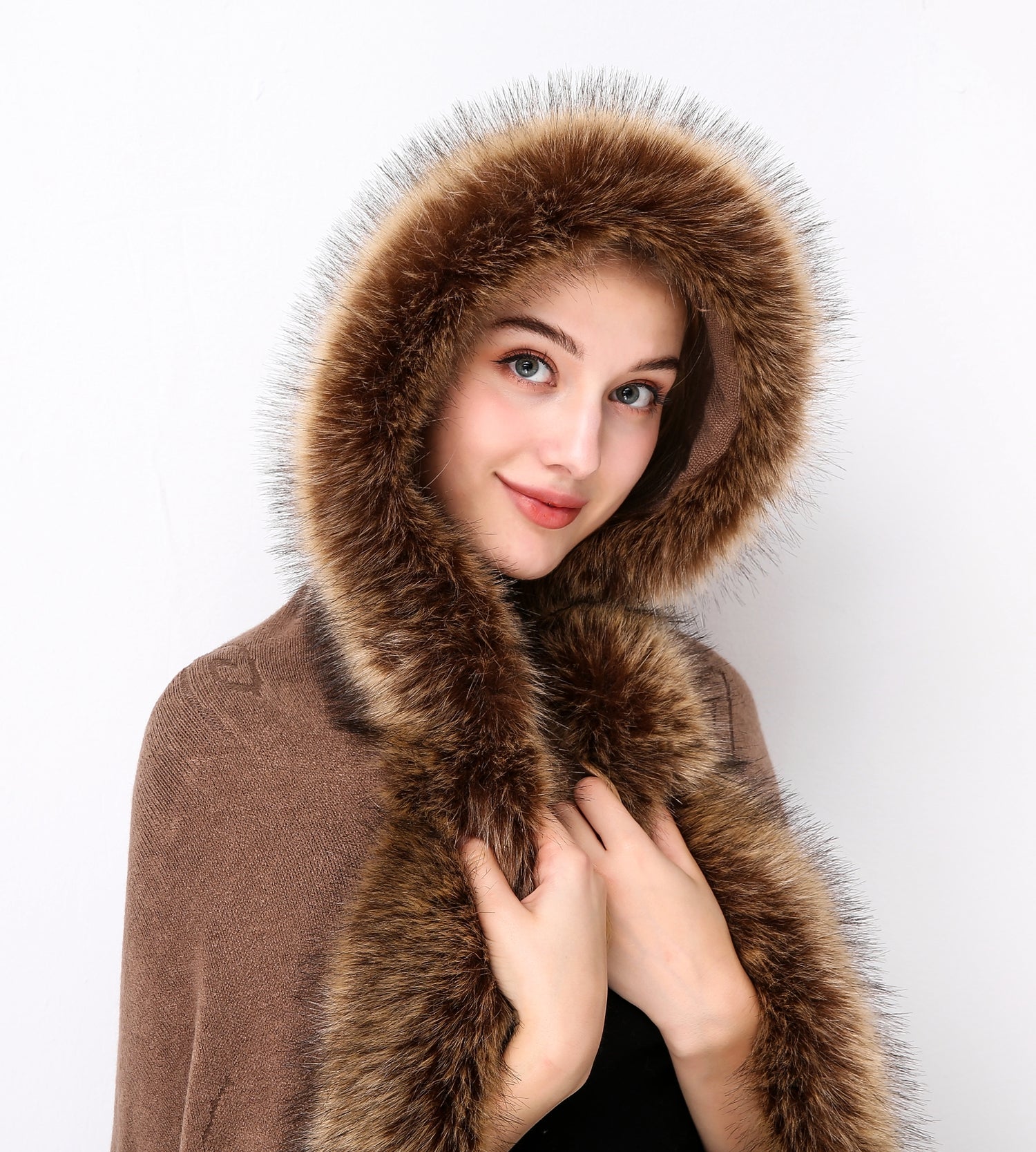 Luxury faux fur hooded cape showing elegant draping and soft texture