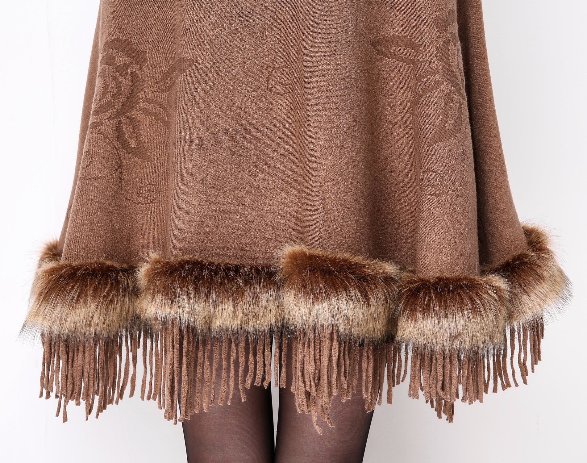 Luxury faux fur hooded cape showing elegant draping and soft texture