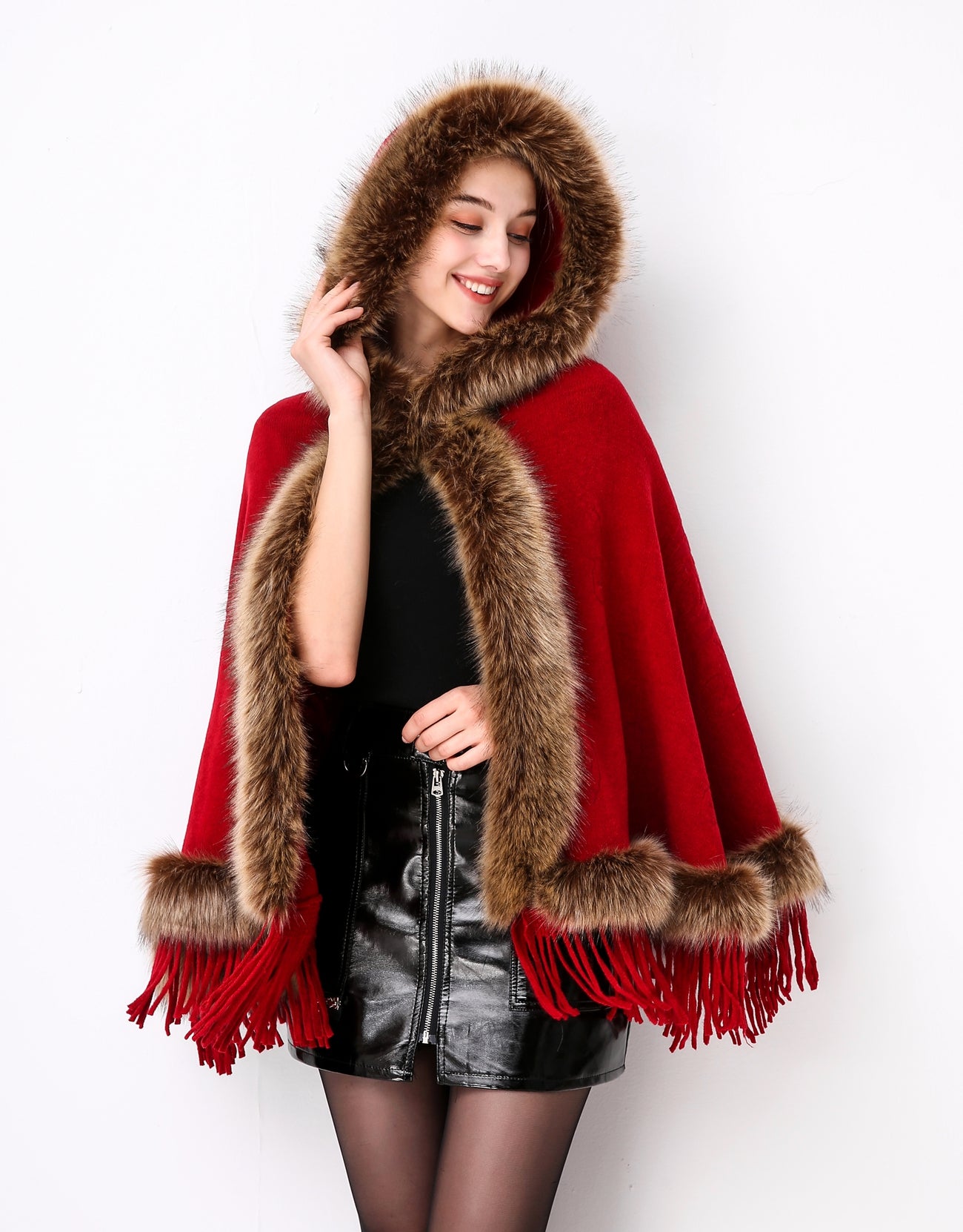 Luxury faux fur hooded cape showing elegant draping and soft texture