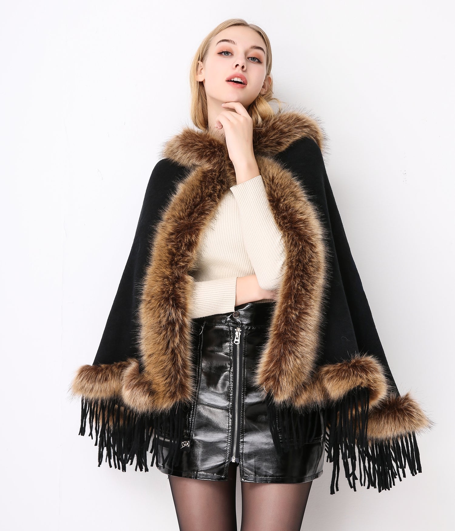 Luxury faux fur hooded cape showing elegant draping and soft texture