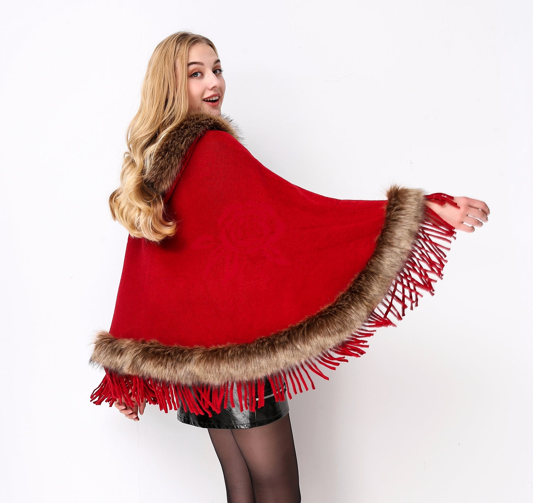 Luxury faux fur hooded cape showing elegant draping and soft texture